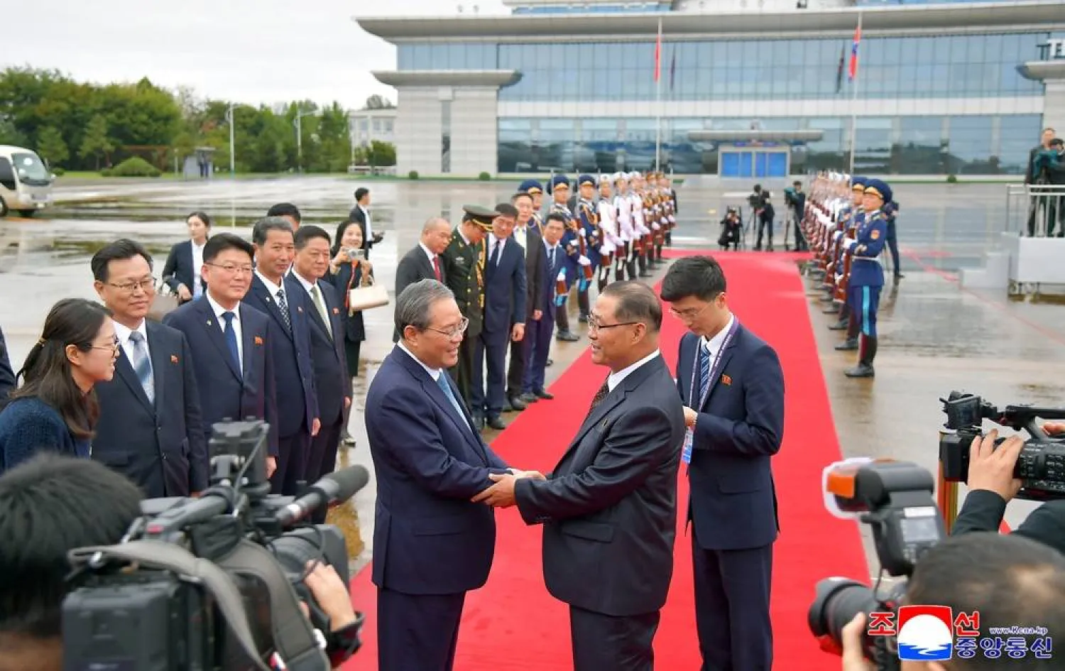 China's Premier Li Qiang shakes hands with North Korea's Premier Pak Thae Song as he departs after his visit, in Pyongyang, North Korea, October 11, 2025, in this photo released by North Korea's official Korean Central News Agency. (KCNA via Reuters) 