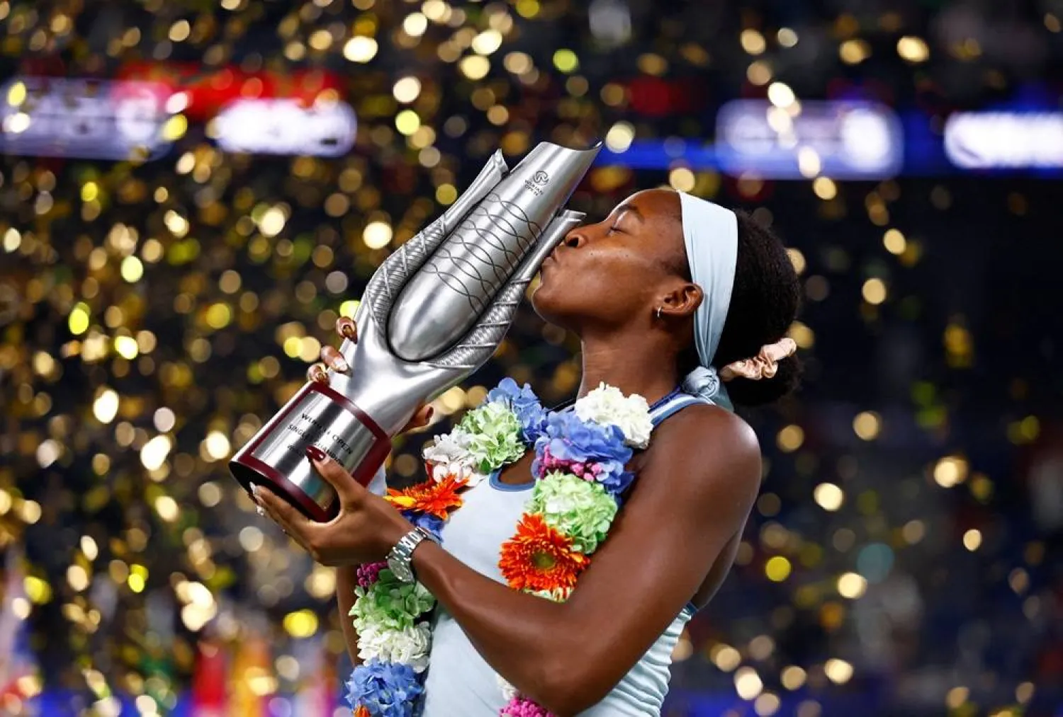  Tennis - WTA 1000 - Wuhan Open - Optics Valley International Tennis Center, Wuhan, China - October 12, 2025 Coco Gauff of the US celebrates with the trophy after winning the final against Jessica Pegula of the US. (Reuters)