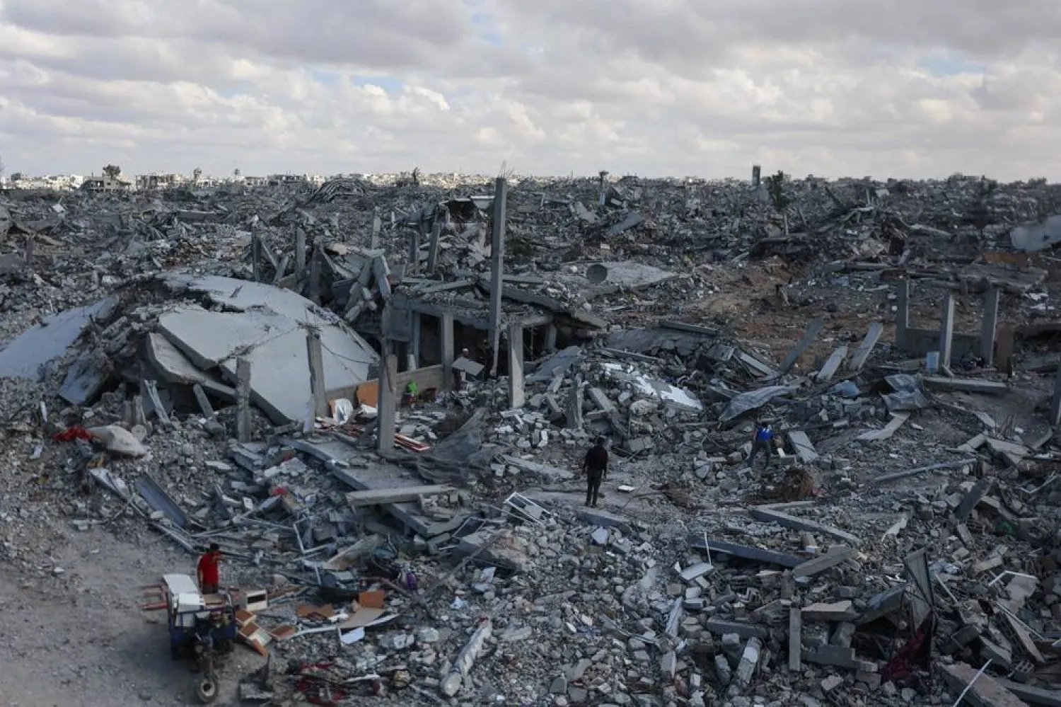 Palestinians search the rubble of buildings amid widespread destruction due to Israeli bombardment in Khan Younis in the southern Gaza Strip, as a ceasefire holds on October 12, 2025. (AFP)