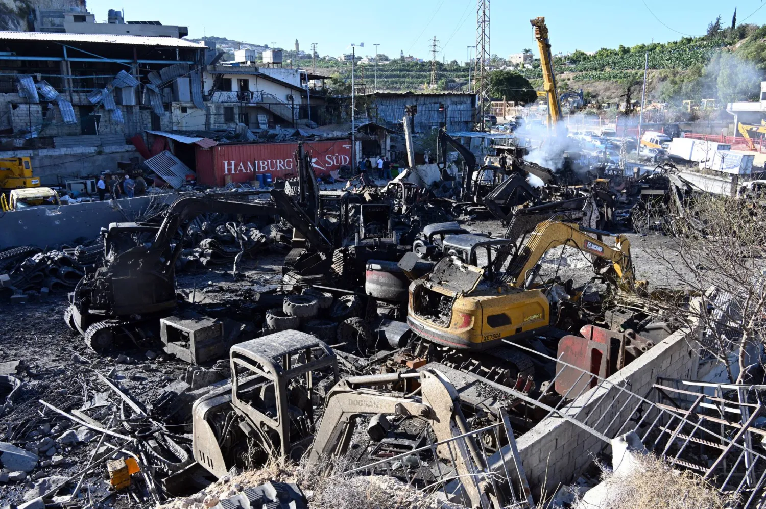 Caterpillar machines are damaged following an Israeli strike in the Msayleh area in southern Lebanon, 11 October 2025. (EPA)