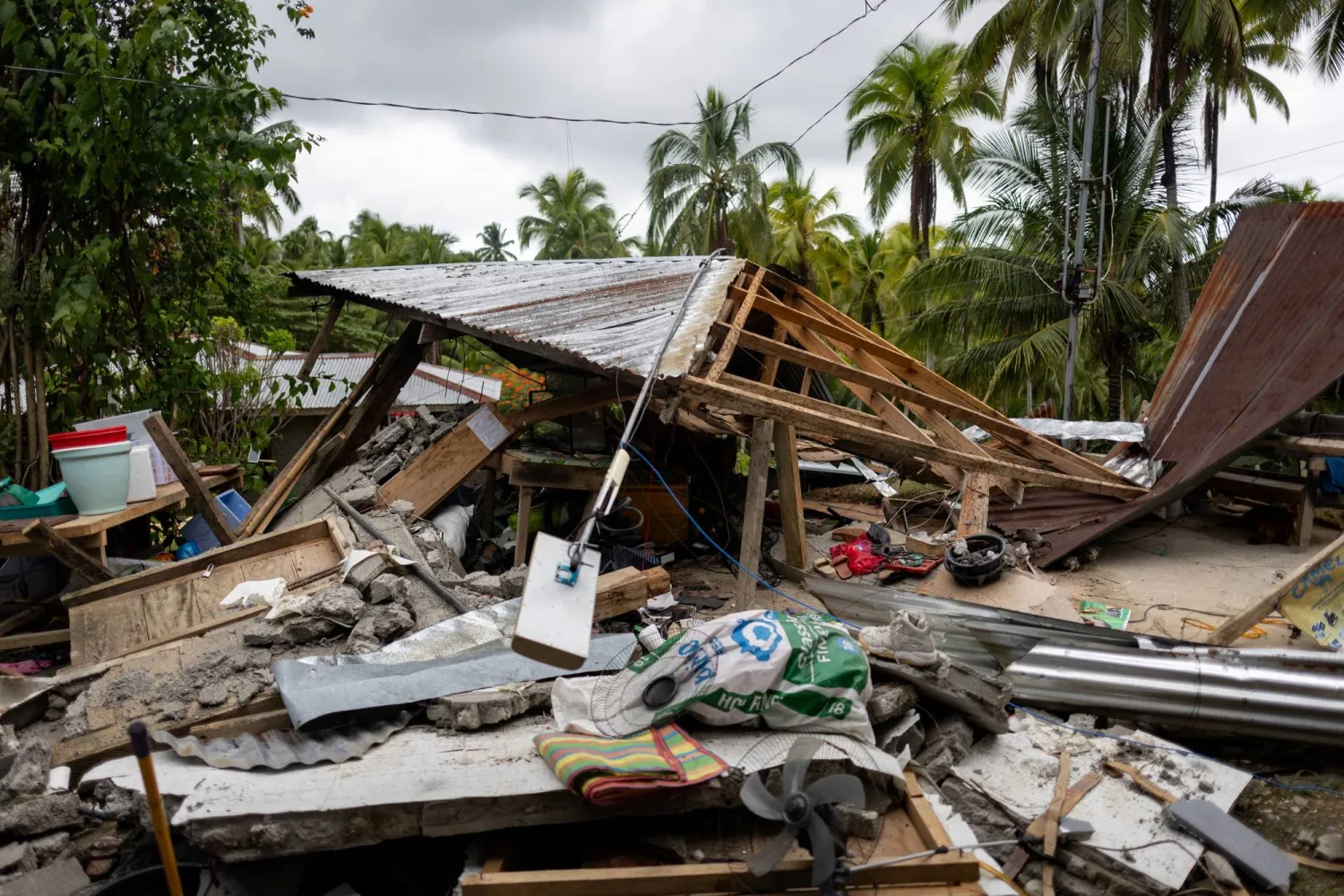 The destroyed house of Pepina and Guilbert Masinading following the 7.4 magnitude quake in Manay, Davao Oriental, Philippines, October 11, 2025. REUTERS/Eloisa Lopez