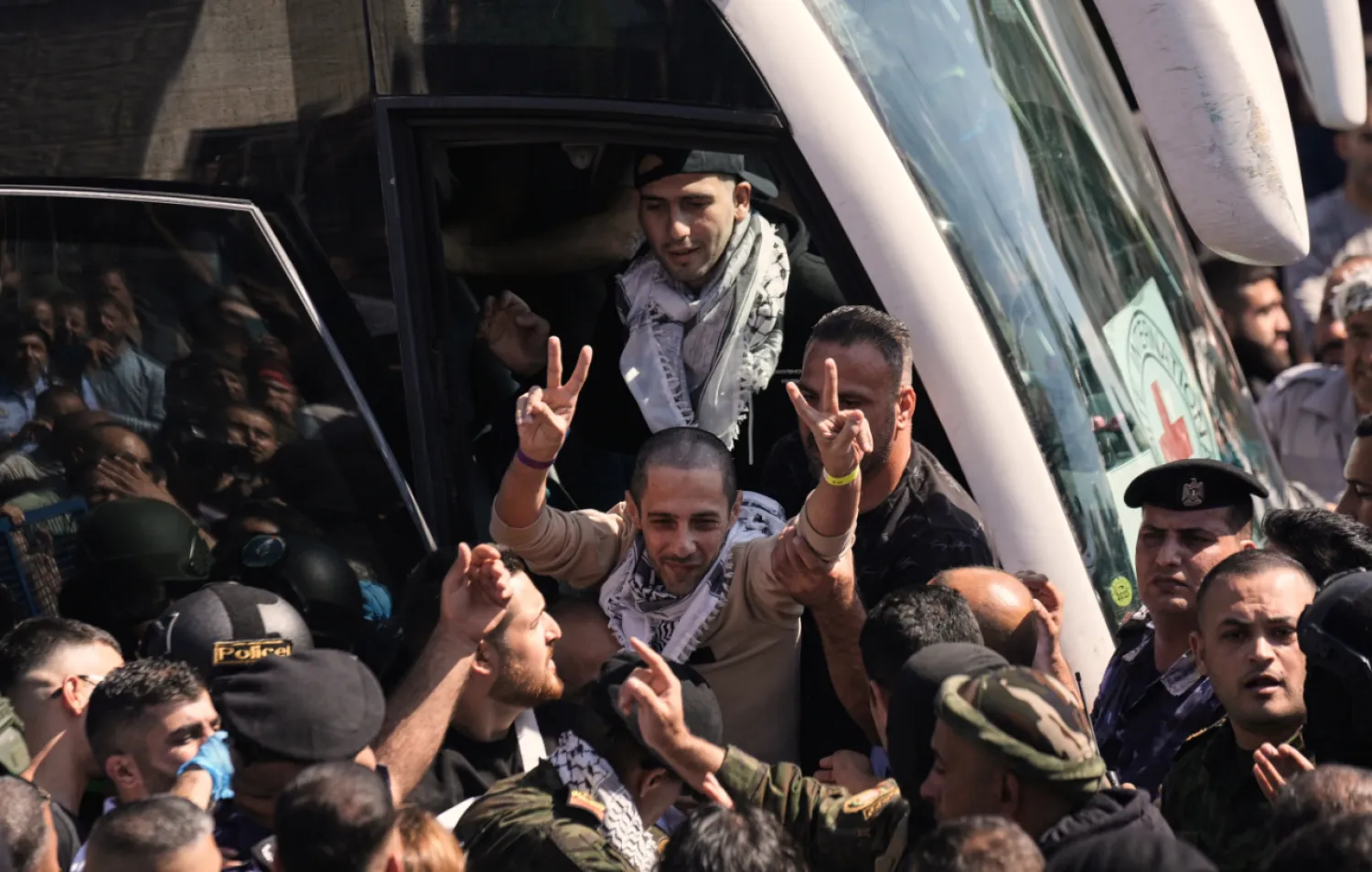 A Palestinian prisoner makes the victory sign after being released from an Israeli prison as part of a ceasefire deal between Israel and Hamas, upon his arrival in the West Bank city of Ramallah, Monday, Oct. 13, 2025. (AP Photo/Majdi Mohammed)