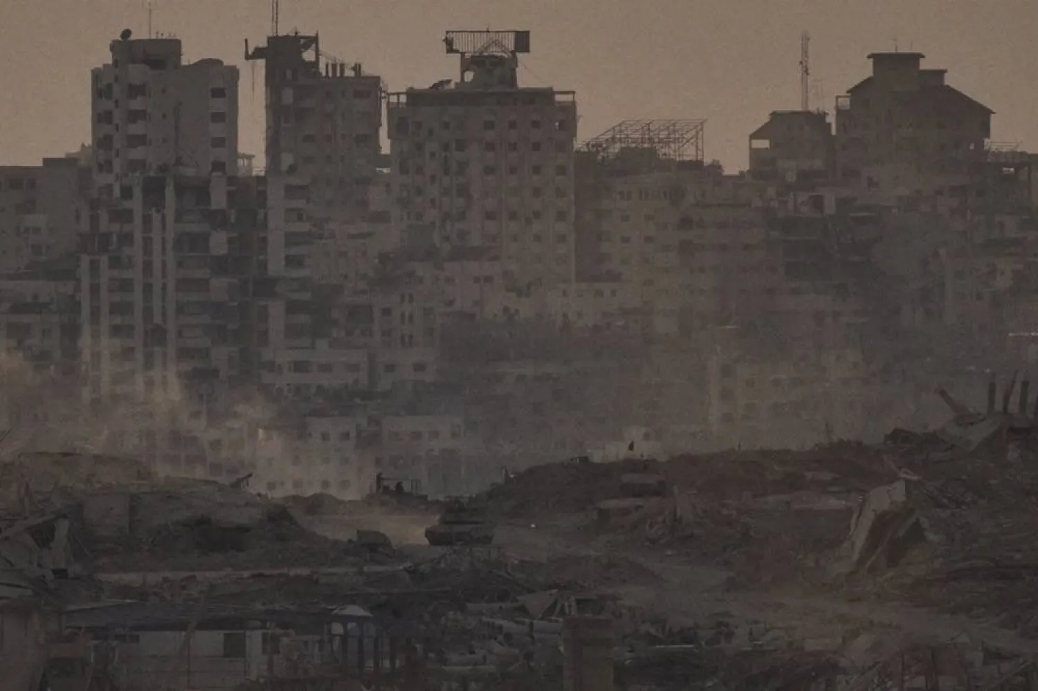  An Israeli tank moves in an area in the Gaza Strip as seen from southern Israel, Tuesday, Oct. 14, 2025. (AP)