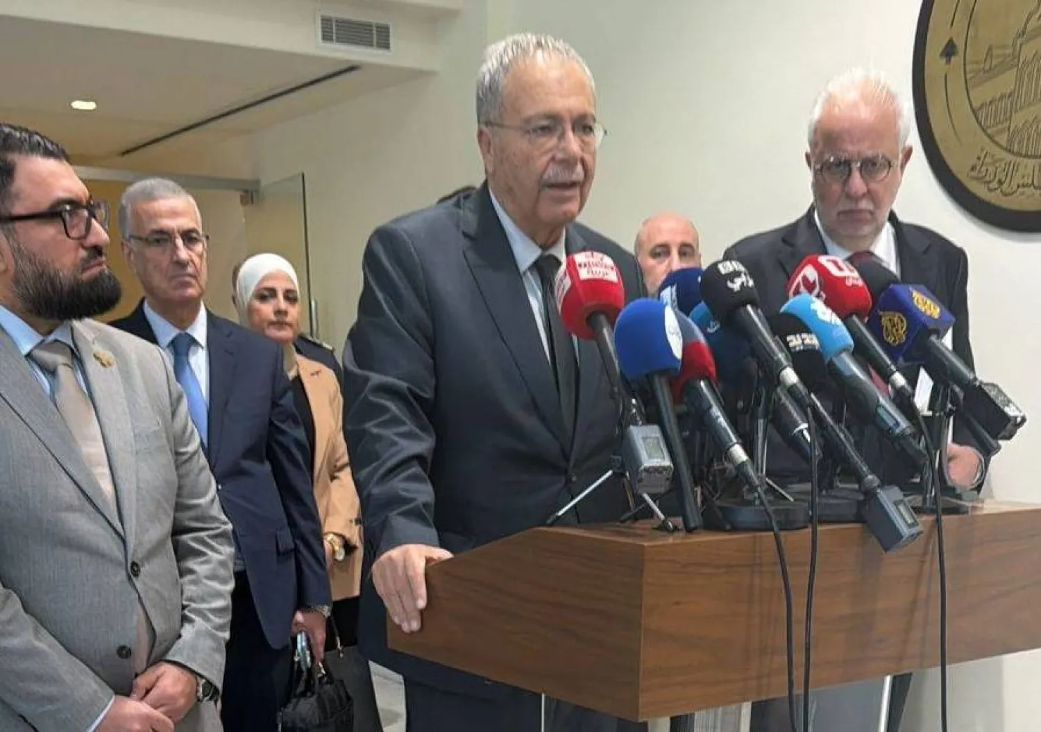 Lebanese Justice Minister Adel Nassar (R) and Deputy Prime Minister Tarek Mitri (C), Syrian Justice Minister Mazhar al-Wais (L) at a press conference in Beirut. (Asharq Al-Awsat) 