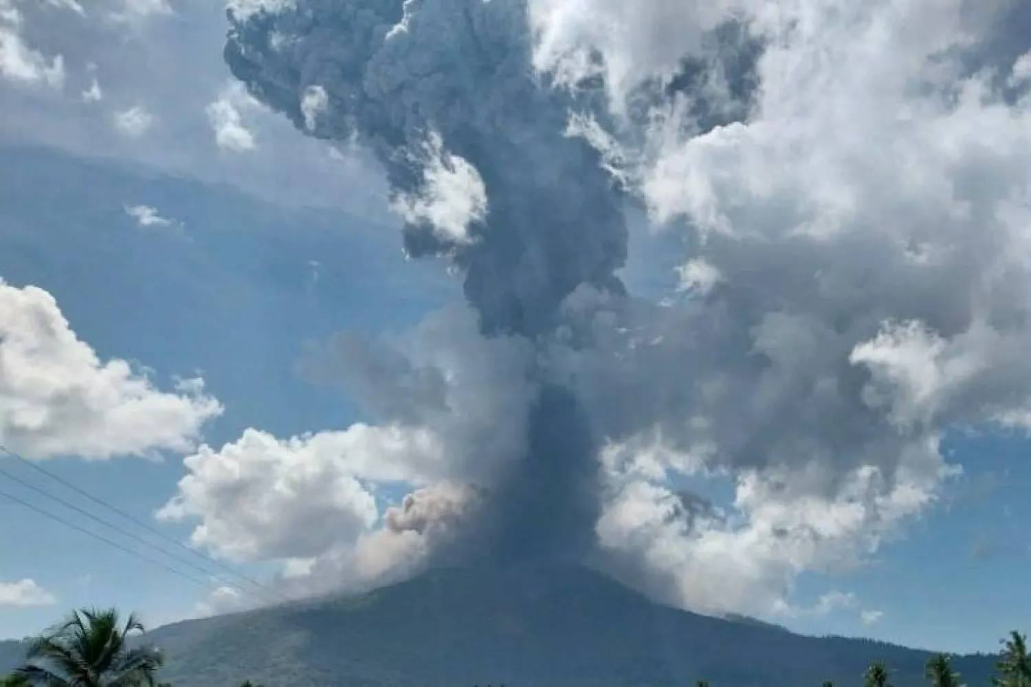 In this photo released by Geological Agency (Badan Geologi) of the Indonesia's Ministry of Energy and Mineral Resources, Mount Lewotobi Laki-Laki spews volcanic material during an eruption in East Flores, Indonesia, Wednesday, Oct. 15, 2025. (Badan Geologi via AP) 