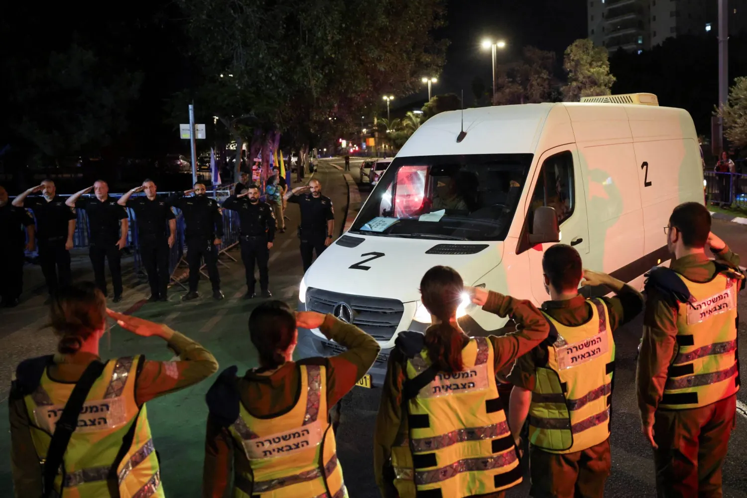 A convoy transporting the bodies of deceased hostages, kidnapped during the deadly October 7, 2023 attack by Hamas, arrives at Abu Kabir forensic center, as part of a prisoner-hostage swap and a ceasefire deal between Israel and Hamas, in Tel Aviv, Israel October 15, 2025. (Reuters)