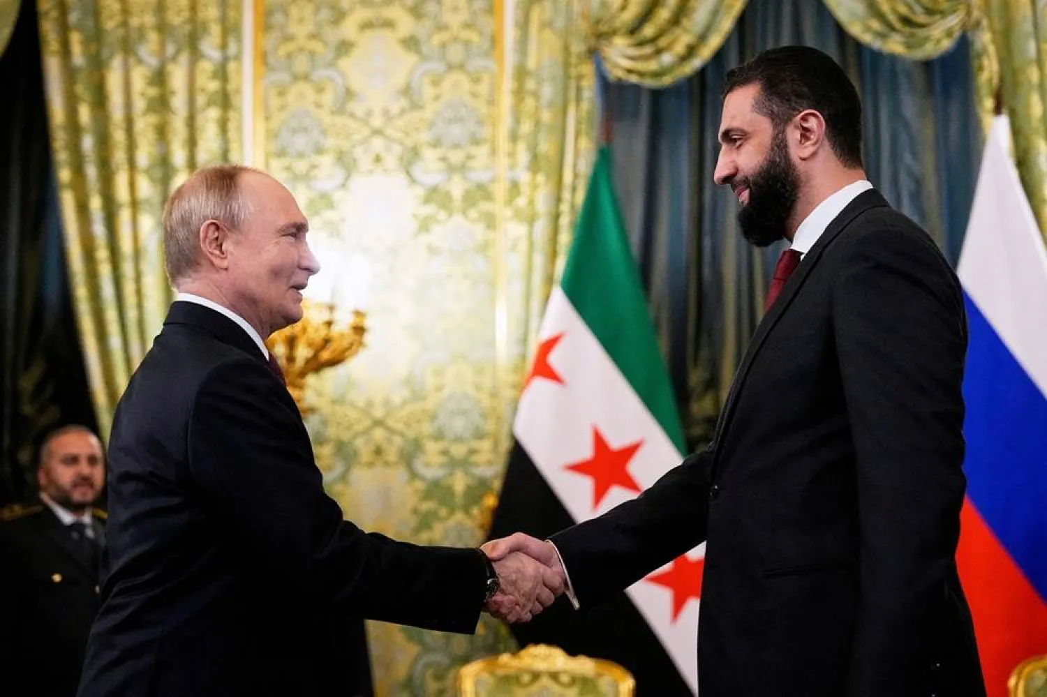  Russia's President Vladimir Putin shakes hands with Syria's President Ahmed al-Sharaa during a meeting at the Kremlin in Moscow, Russia, October 15, 2025. (Alexander Zemlianichenko/Pool via Reuters)