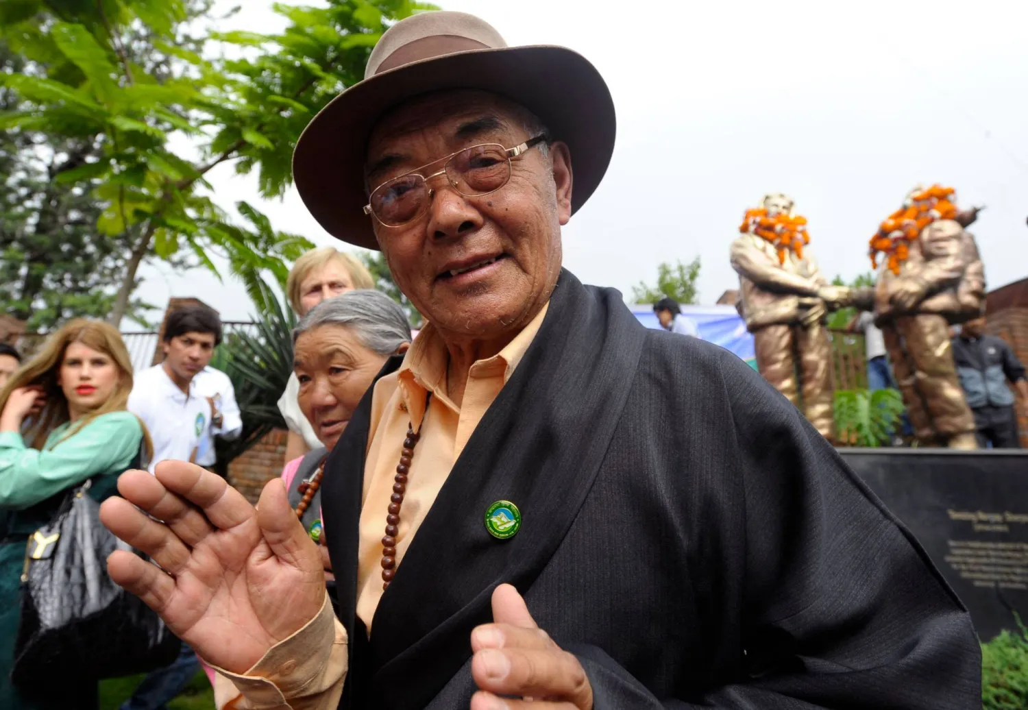 (FILES) Kancha Sherpa gestures after offering garlands over the statues of Tenzing Norgay and Edmund Hillary during the Mount Everest Diamond Jubilee celebrations in Kathmandu on May 29, 2013. (Photo by Prakash MATHEMA / AFP)