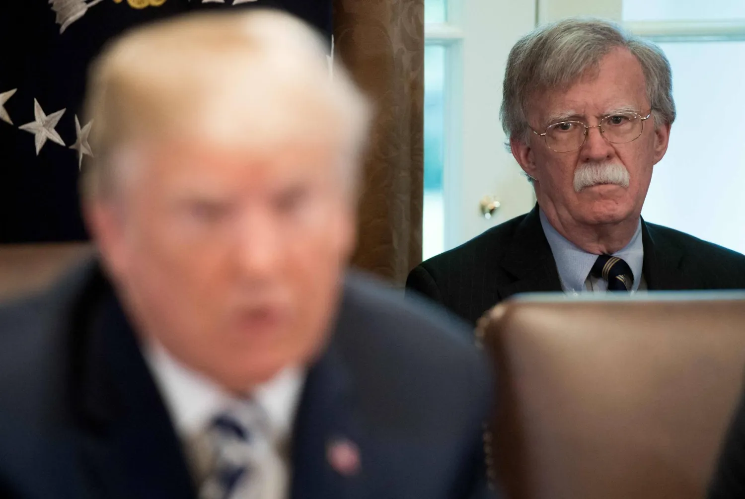 US President Donald Trump speaks alongside National Security Adviser John Bolton (R) during a Cabinet Meeting in the Cabinet Room of the White House in Washington, DC, May 9, 2018. (AFP)