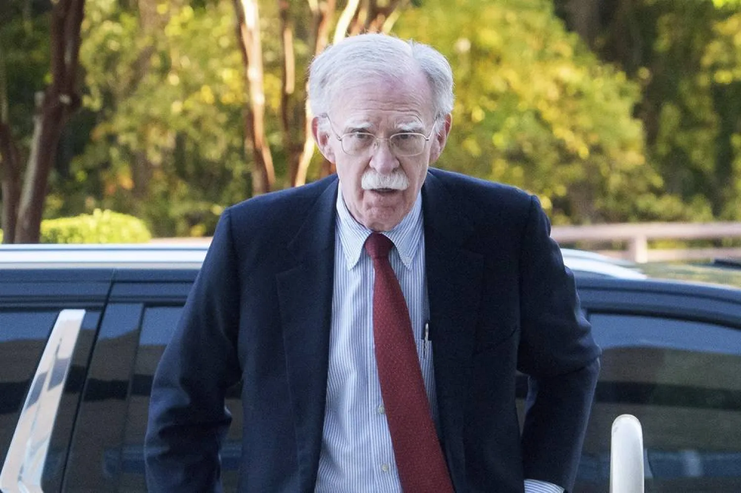 Former Trump administration national security adviser John Bolton, left, arrives for his arraignment at the Greenbelt Federal Courthouse in Greenbelt, Md., Friday, Oct. 17, 2025. (AP)