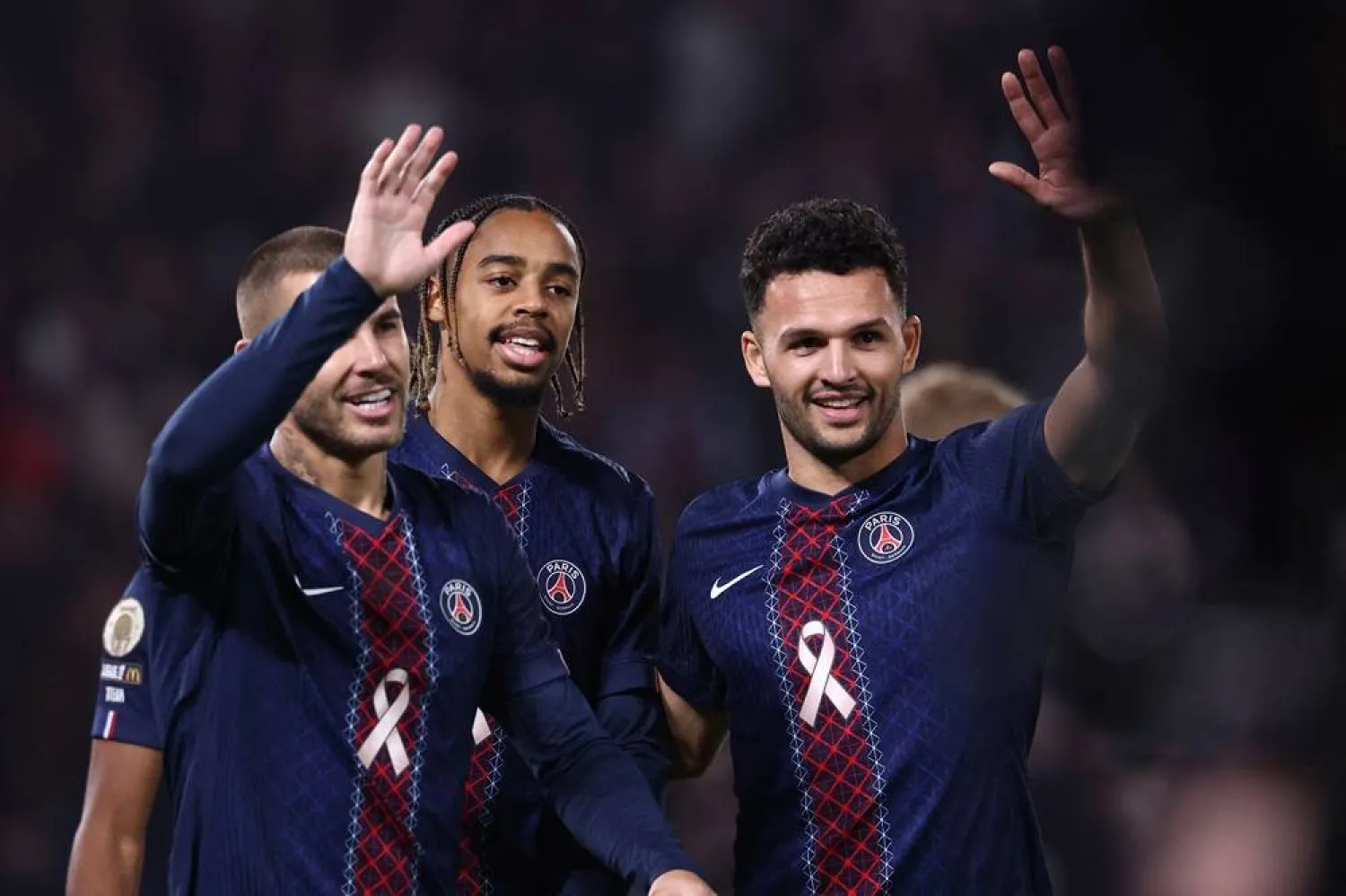 Paris Saint-Germain's French forward #29 Bradley Barcola (C) celebrates with Paris Saint-Germain's Portuguese forward #09 Goncalo Ramos (R) and Paris Saint-Germain's French defender #21 Lucas Hernandez (L) after scoring PSG's first goal during the French L1 football match between Paris Saint-Germain (PSG) and RC Strasbourg Alsace at the Parc des Princes Stadium in Paris on October 17, 2025. (AFP) 