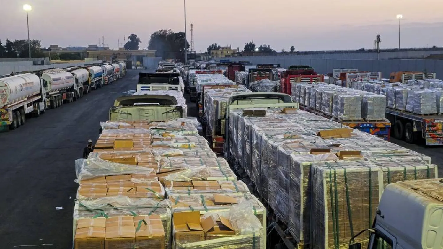 Trucks carrying humanitarian aid and fuel line up at the crossing into the Gaza Strip at the Rafah border on the Egypt side, amid a ceasefire between Israel and Hamas in Gaza, in Rafah, Egypt, October 17, 2025. (Reuters) 