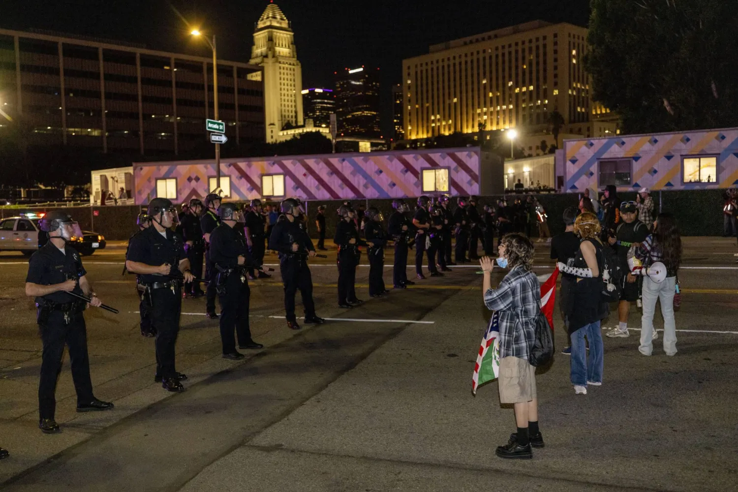 LAPD officers and protesters face off on Alameda Street after a dispersal order in Los Angeles, California, USA, 18 October 2025. EPA/JILL CONNELLY