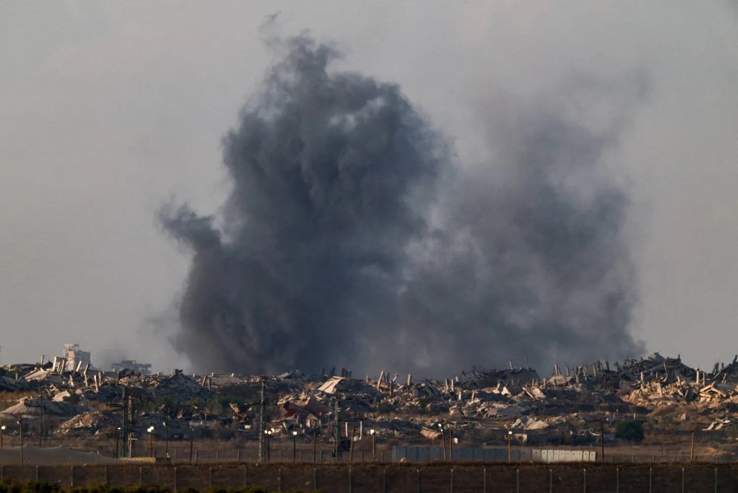 Smoke rises from Gaza following an explosion, as seen from Israel, October 19, 2025. REUTERS/Amir Cohen