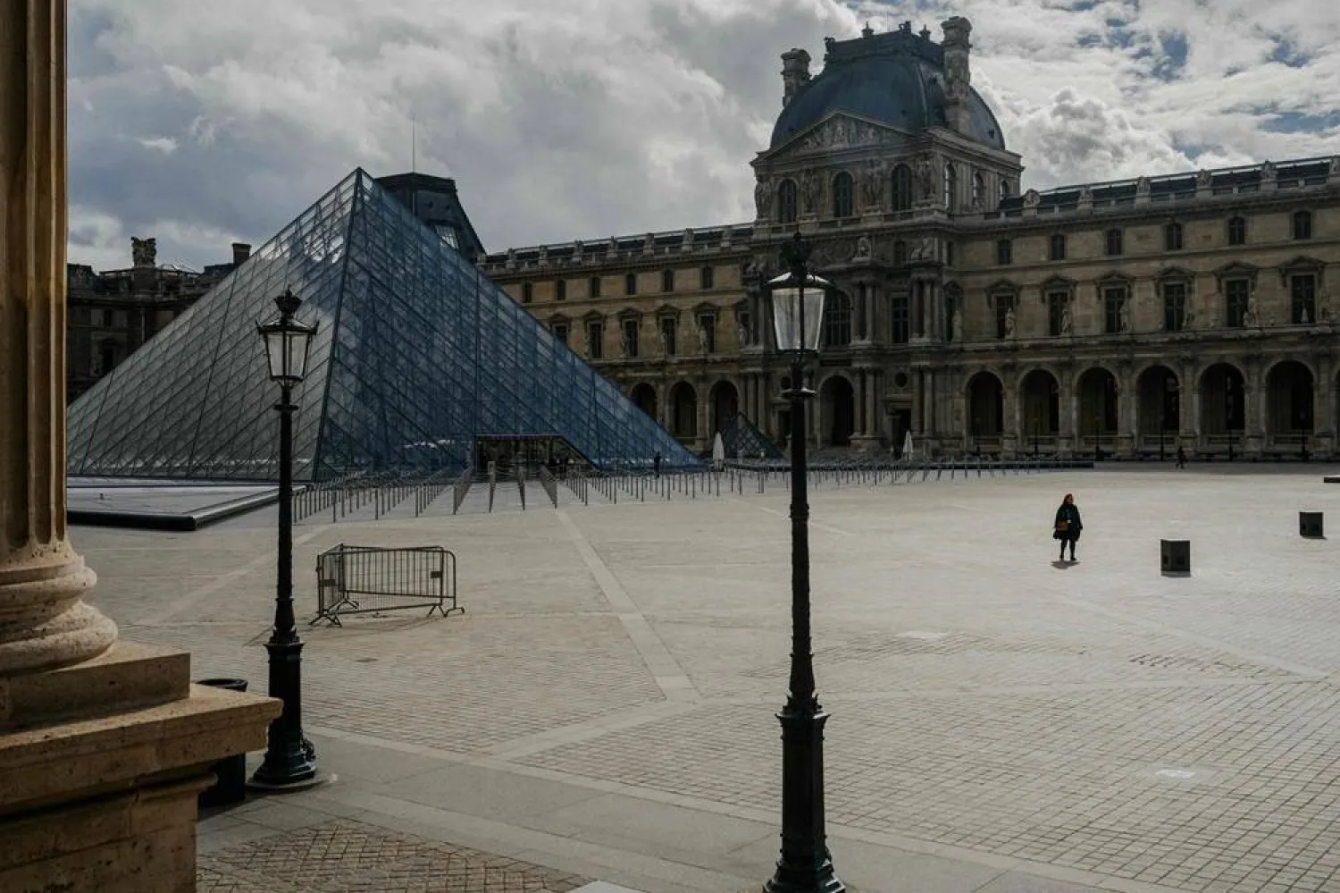 The Louvre pyramid courtyard is seen almost completely empty following the announcement that the museum will remain closed for a second day after thieves stole priceless jewels from the museum in Paris a day earlier, in Paris on October 20, 2025. (AFP)