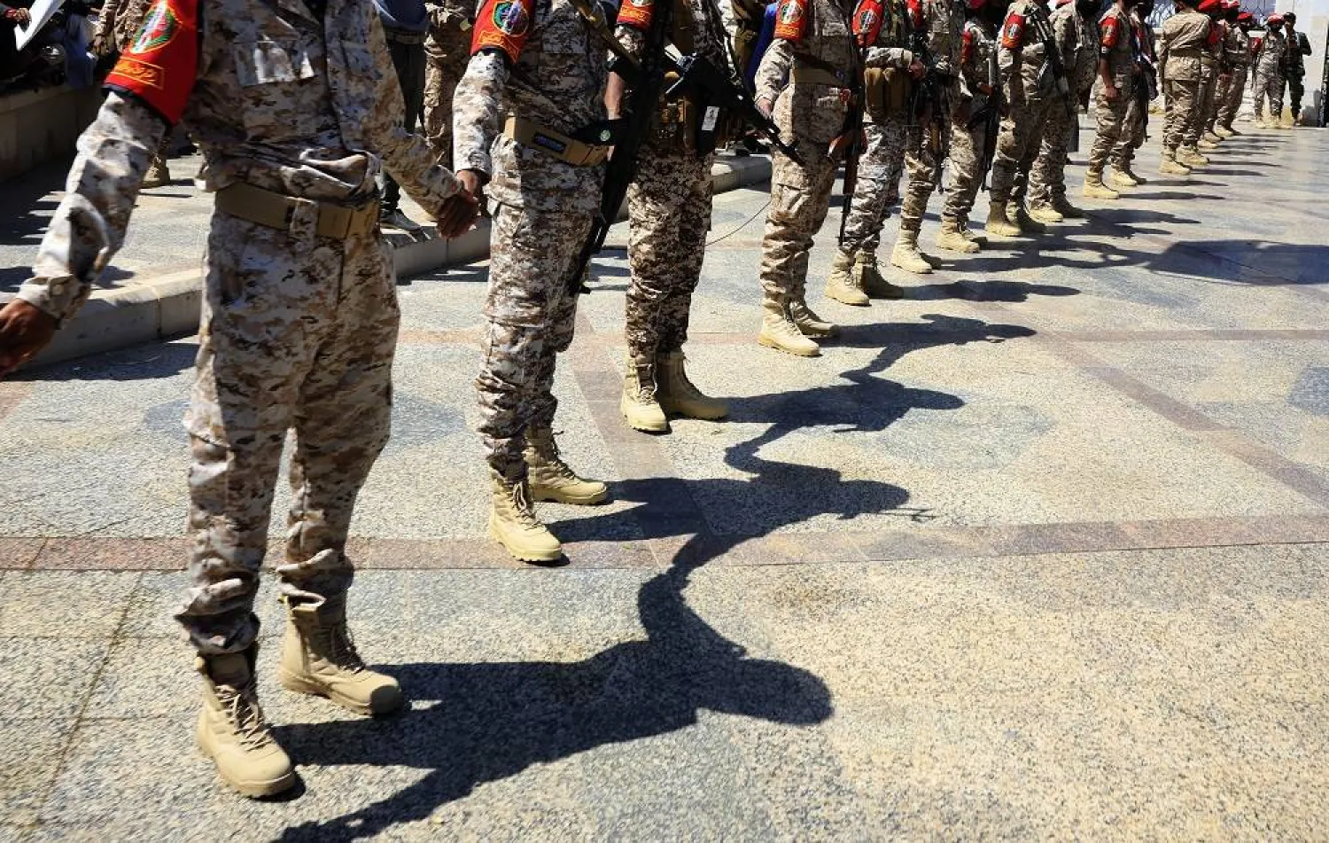 Houthi militants stand guard during the funeral procession for their chief of staff, Mohammed al-Ghamari, and his companions, who were killed in an Israeli strike, during a funeral procession in Sanaa, Yemen, 20 October 2025. (EPA) 