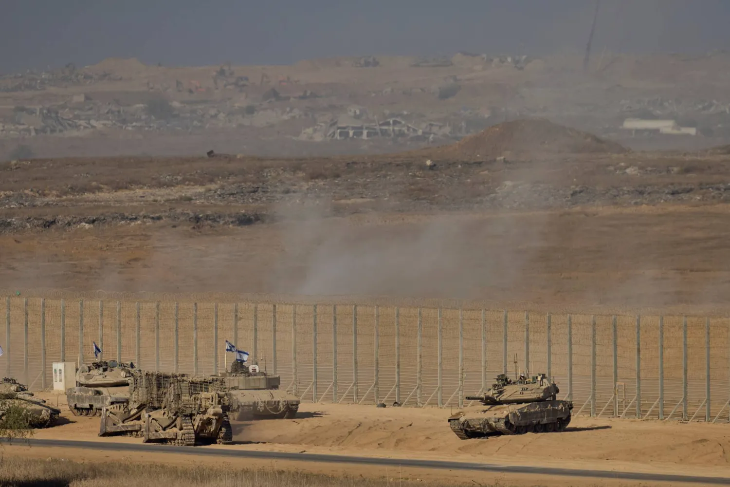 Israeli soldiers and tanks are seen near the Gaza Strip border in southern Israel, Monday, Oct. 20, 2025. (AP)