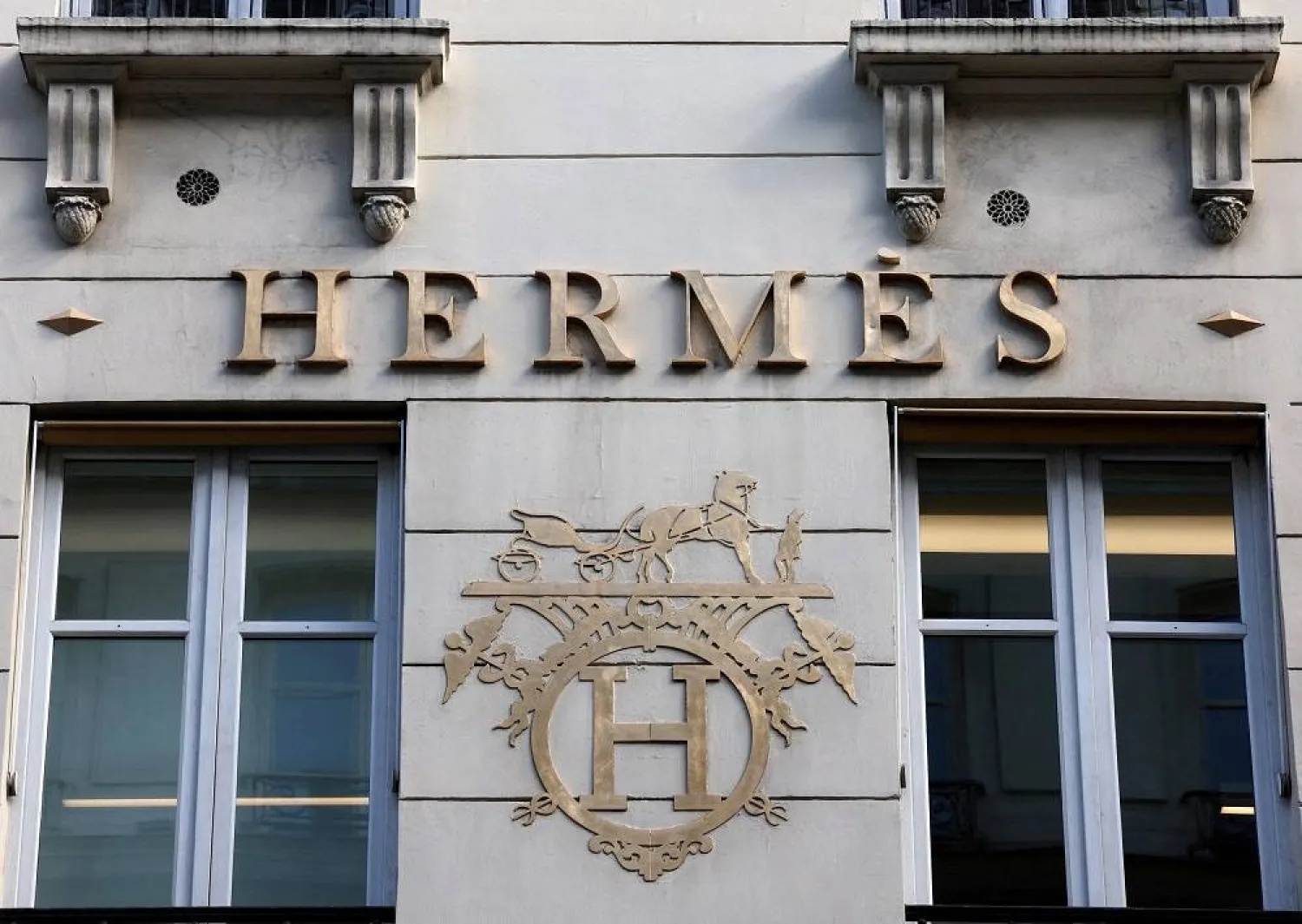 A logo of fashion house Hermes is seen outside a shop in Paris, France, April 15, 2024. (Reuters) 