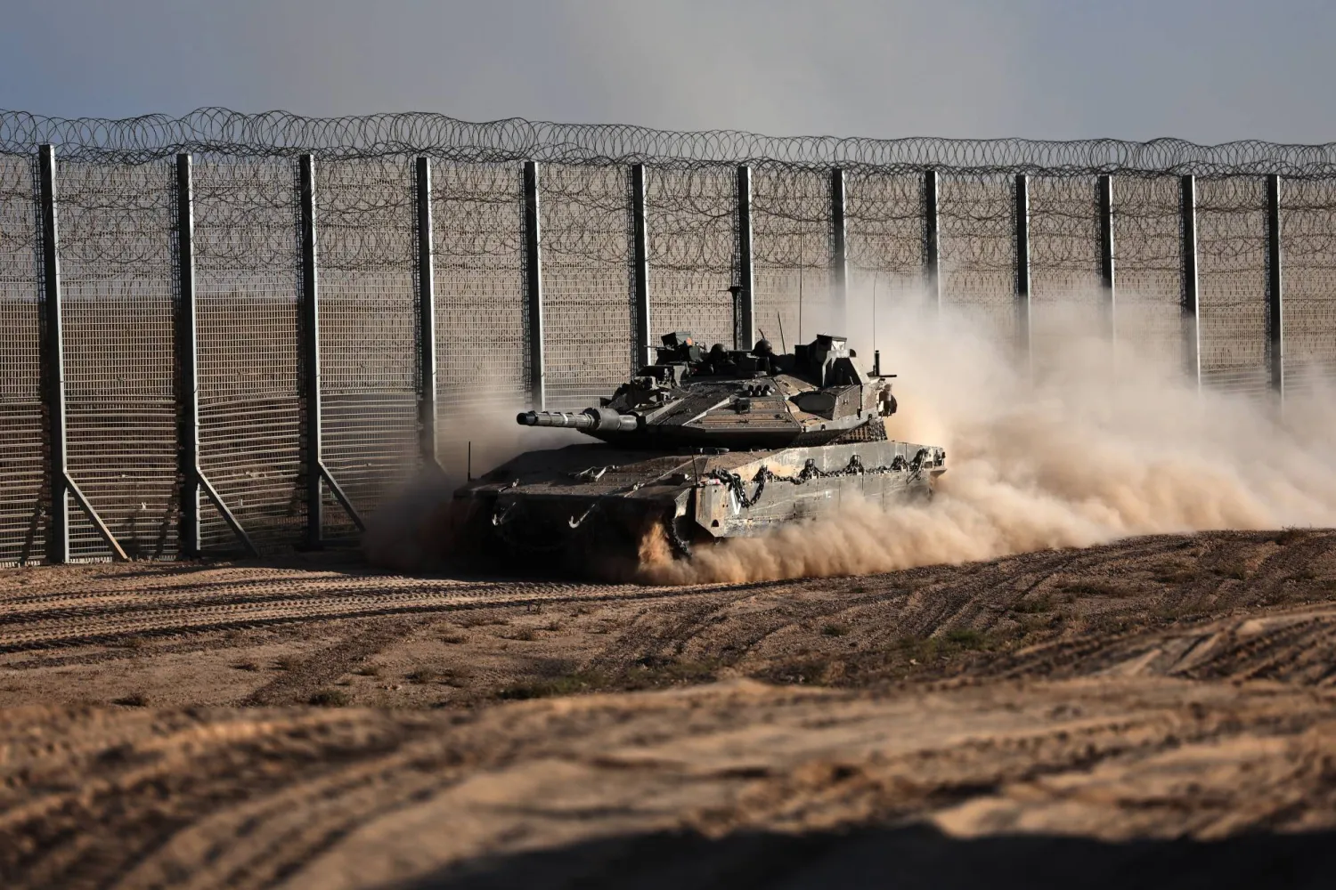 An Israeli tank maneuvers at an undisclosed location near the border with the Gaza Strip in southern Israel, 21 October 2025. EPA/ATEF SAFADI