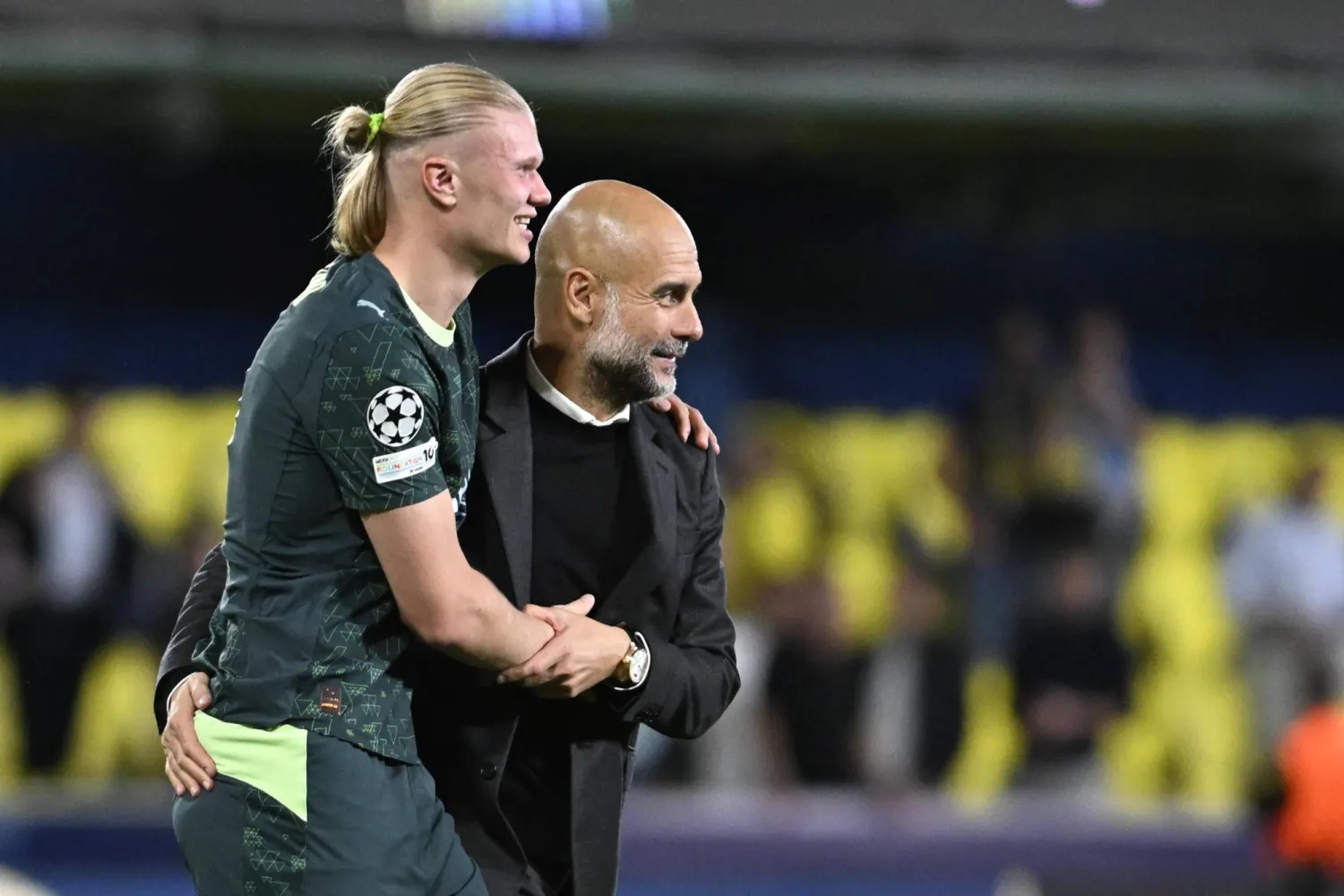 Manchester's head coach Pep Guardiola (R) and striker Erling Haaland (L) react at the end of the UEFA Champions League match between Villarreal CF and Manchester City at the La Ceramica stadium in Villarreal, Spain, 21 October 2025. (EPA)