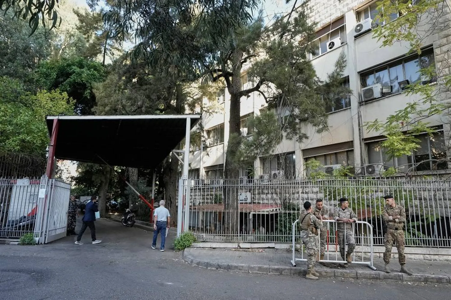 Lebanese soldiers stand guard outside the Justice Palace where Fadel Shaker appeared in court after 12 years on the run, in Beirut, Lebanon, Wednesday, Oct. 22, 2025. (AP)