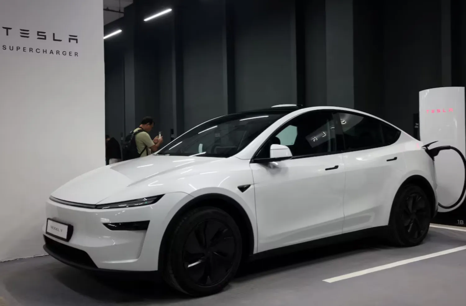 A Tesla Model Y is parked at a charging station in New Delhi, India, August 11, 2025. REUTERS/Bhawika Chhabra 