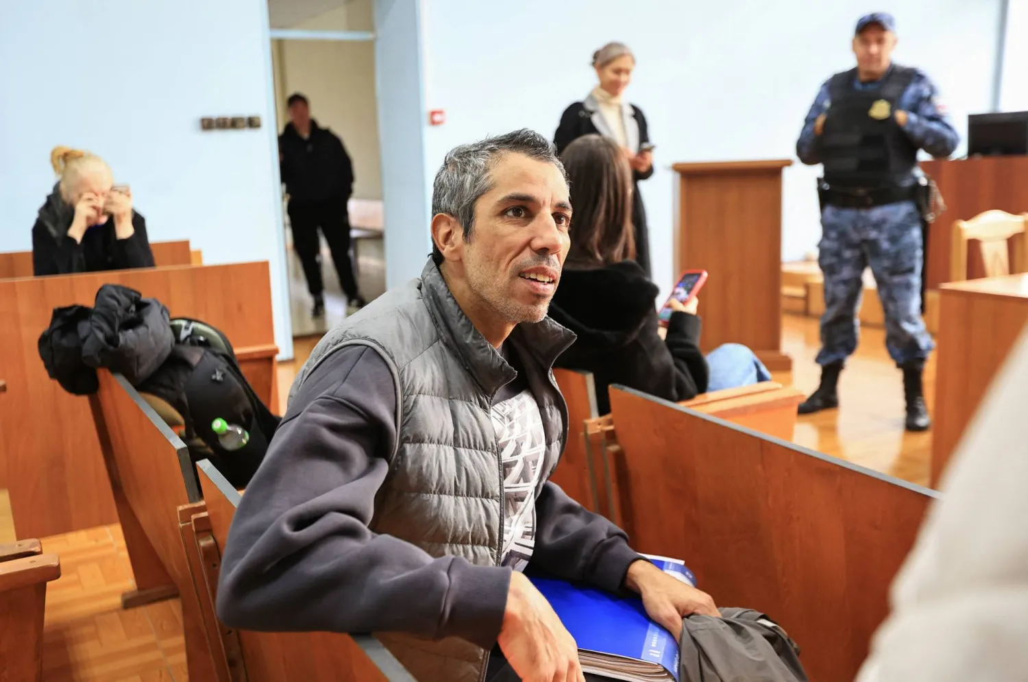 French cyclist Sofiane Sehili sits in a courtroom in the far eastern settlement of Pogranichniy, Russia, October 23, 2025. REUTERS/Tatiana Meel