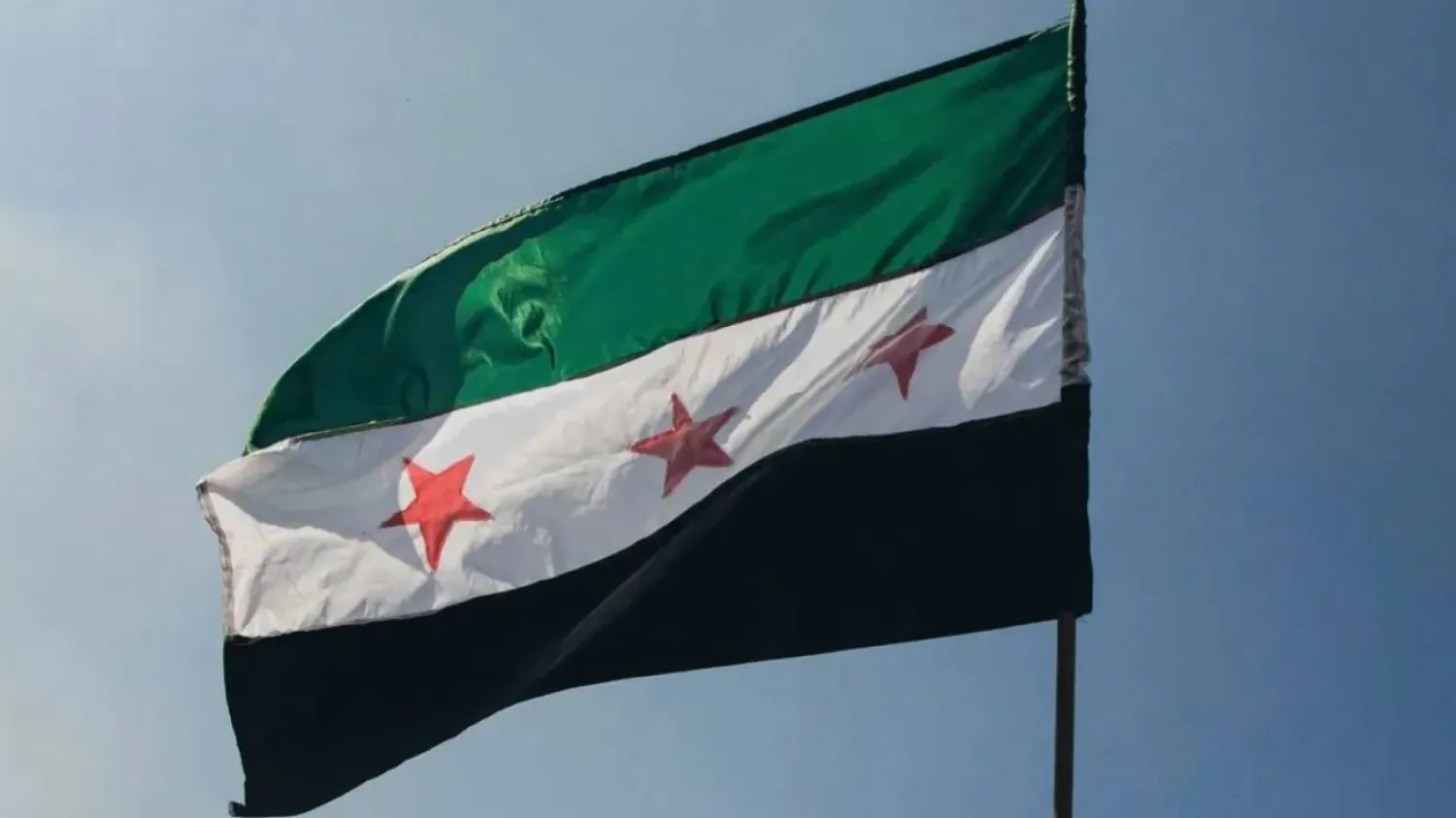 A Syrian flag waves in Damascus. (Getty Images/AFP)