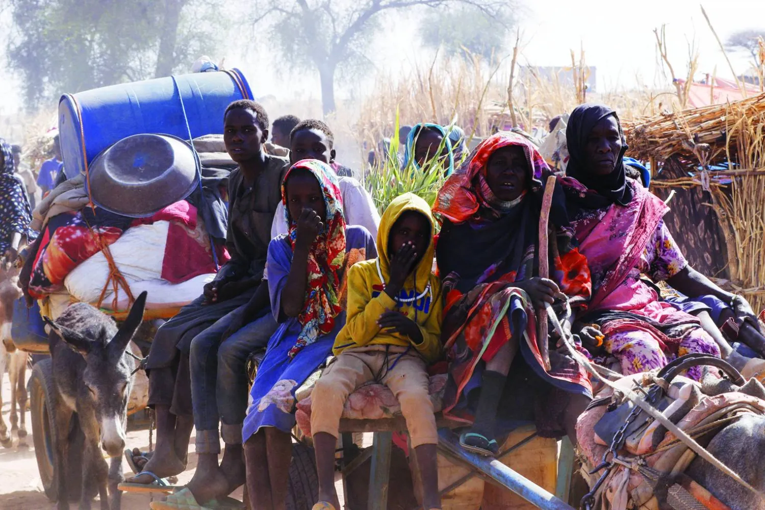 Displaced people ride an animal-drawn cart, following Rapid Support Forces (RSF) attacks on Zamzam displacement camp, in the town of Tawila, North Darfur, Sudan April 15, 2025. REUTERS/Stringer    