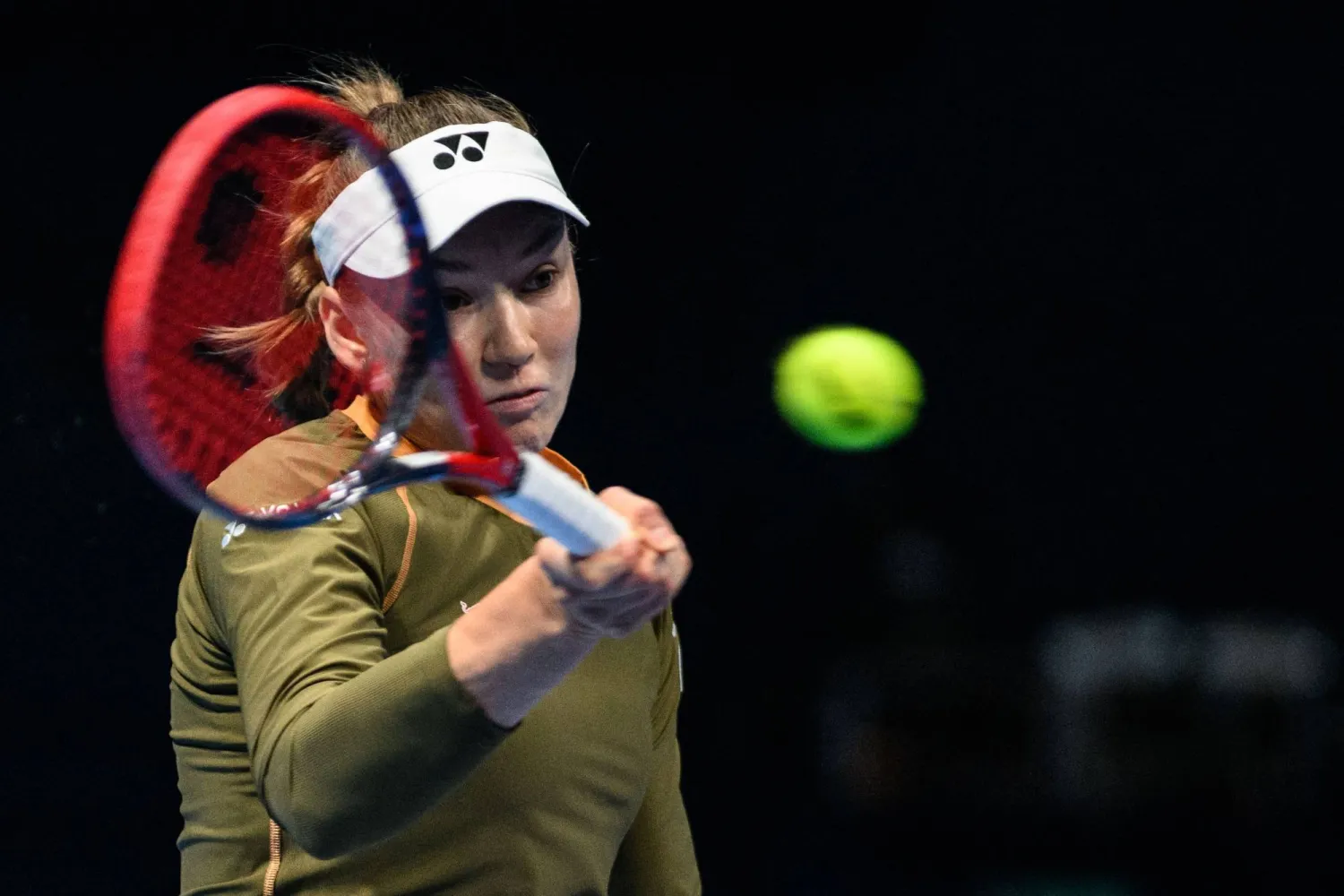 Kazakhstan's Elena Rybakina hits a return to Canada's Victoria Mboko during their women's singles match at the Pan Pacific Open tennis tournament in Tokyo on October 24, 2025. (Photo by Philip FONG / AFP)