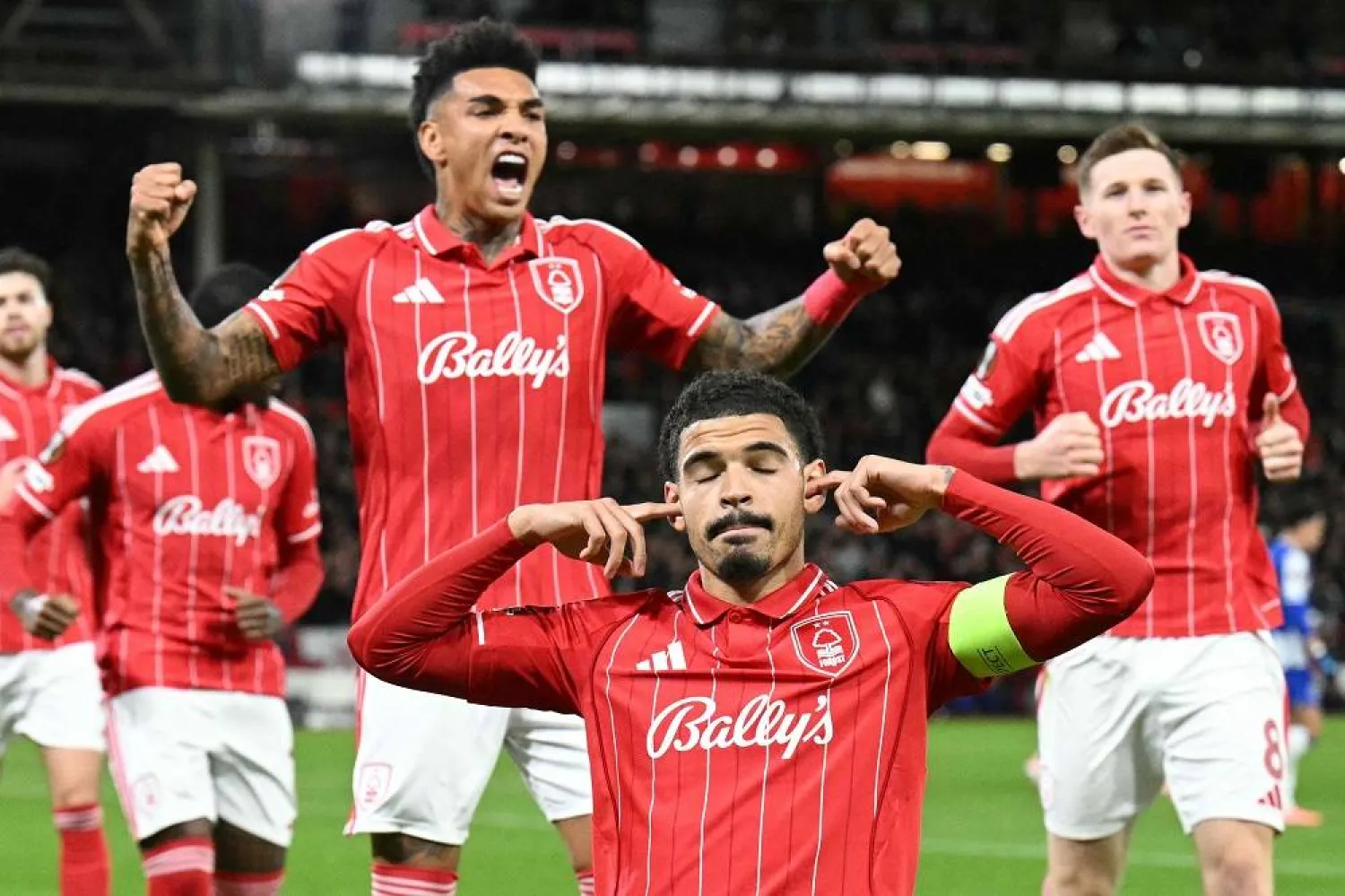 Nottingham Forest's English midfielder #10 Morgan Gibbs-White (C) celebrates scoring the opening goal from the penalty spot for 1-0 during the UEFA Europa League league-stage football match between Nottingham Forest and Porto at The City Ground in Nottingham, central England, on October 23, 2025. (AFP)