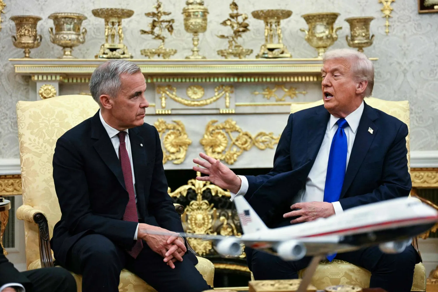 US President Donald Trump meets with Canadian Prime Minister Mark Carney in the Oval Office of the White House in Washington, DC on October 7, 2025. (AFP)