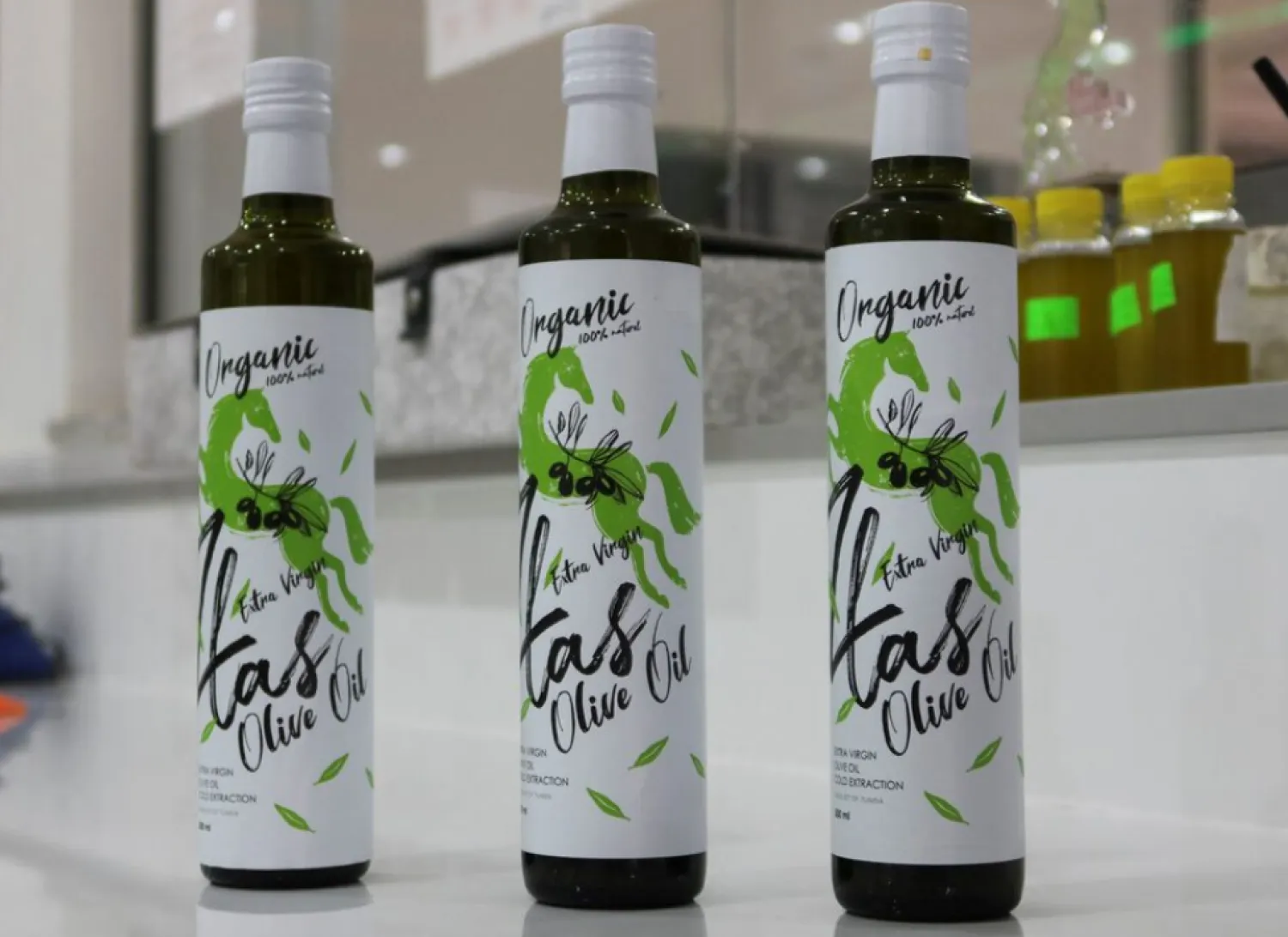 'Zlas' extra virgin olive oil bottles are displayed at the laboratory of Mustapha Mtiraoui's oil mill, in Kairouan, Tunisia February 24, 2024. REUTERS/Jihed Abidellaoui