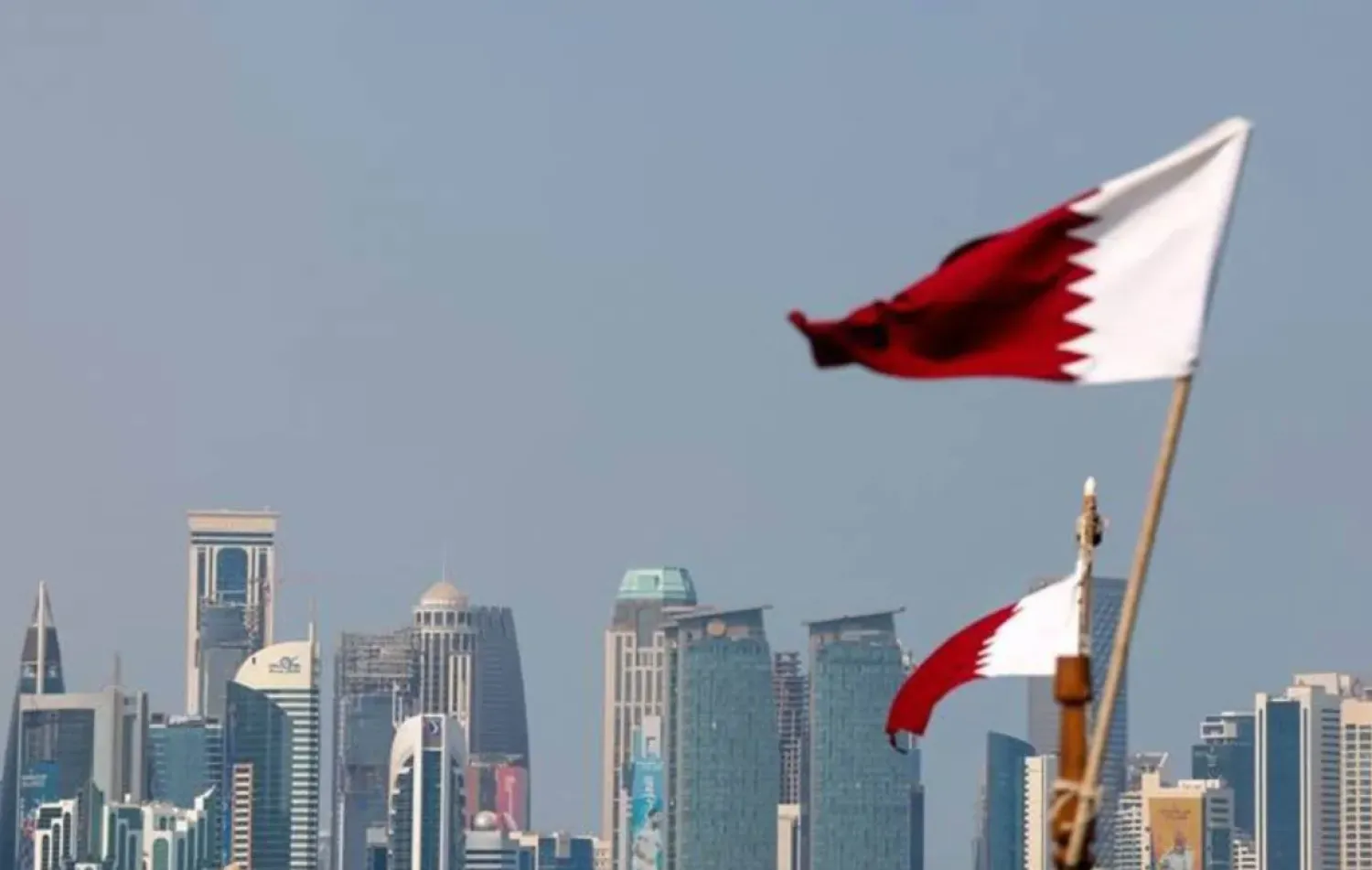 Qatari flag flutters in Doha - AAWSAT/File

