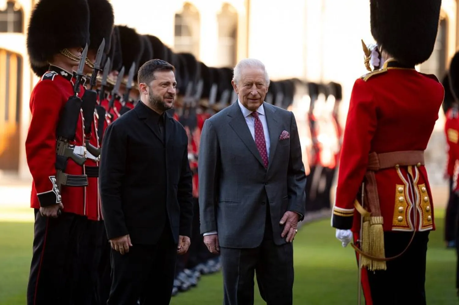 Center from left: Ukraine's President Volodymyr Zelensky, Britain's King Charles III and Major Ben Tracey inspect a guard of honor at Windsor Castle, England, Friday, Oct, 24, 2025. (AP) 