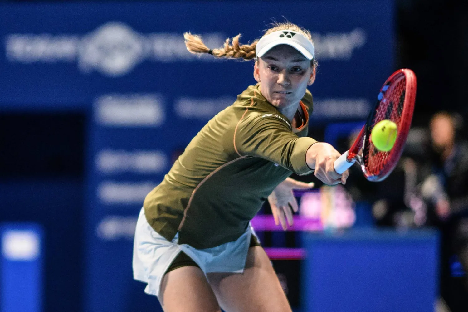 Kazakhstan's Elena Rybakina hits a return to Canada's Victoria Mboko during their women's singles match at the Pan Pacific Open tennis tournament in Tokyo on October 24, 2025. (Photo by Philip FONG / AFP)