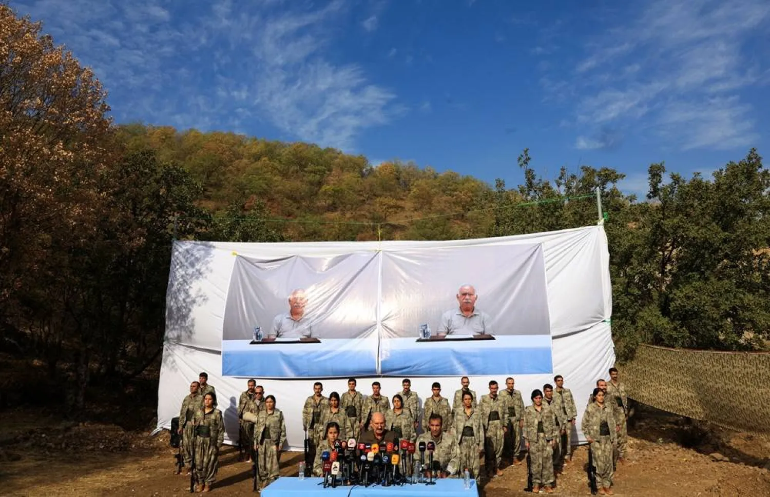 Fighters with the Kurdistan Workers' Party (PKK) line up during a disarmament ceremony marking a significant step toward ending the decades-long conflict between Türkiye and the outlawed group in Qandil mountains, Iraq October 26, 2025. (Reuters) 