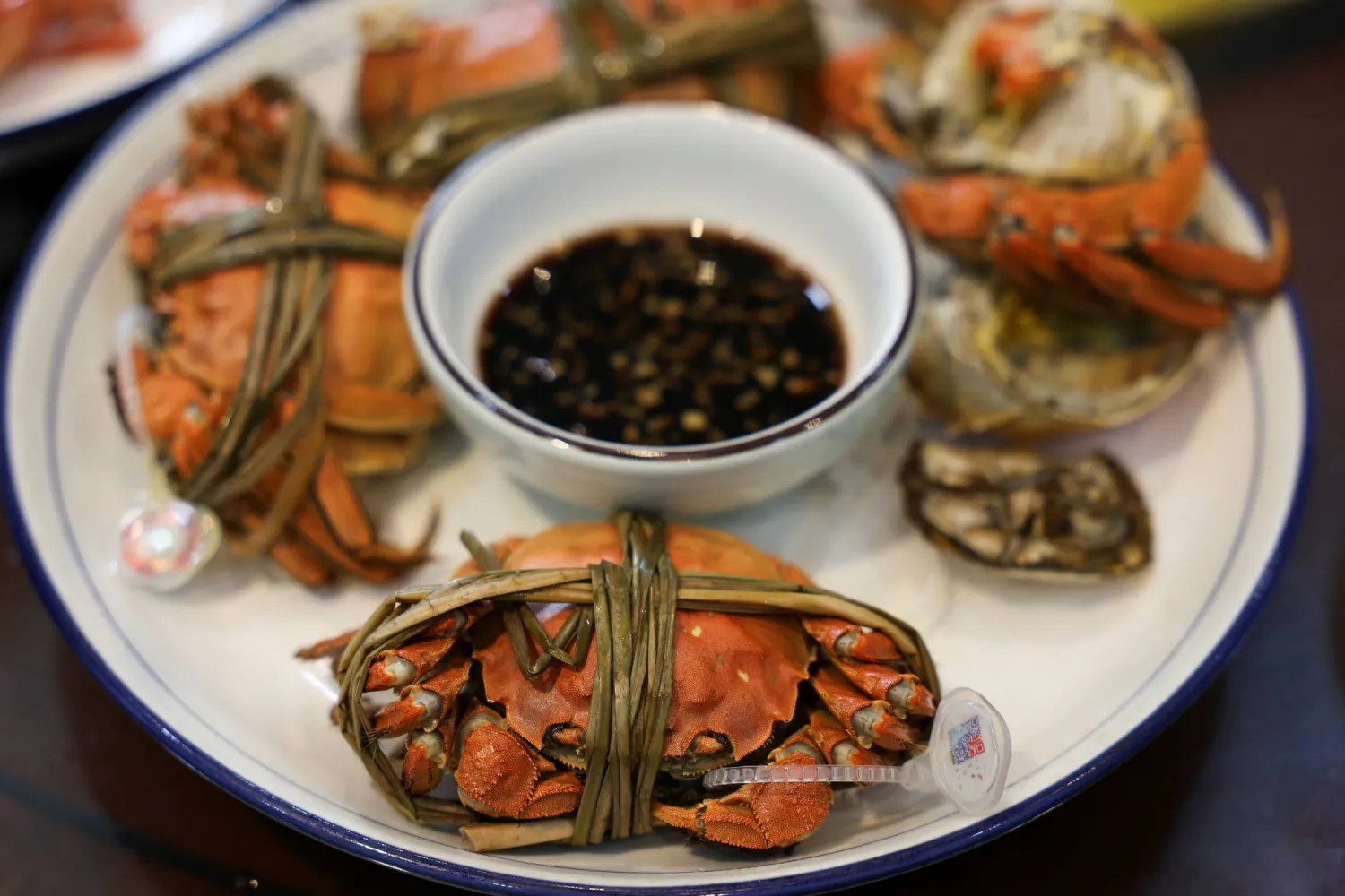 Steamed hairy crabs sit on a plate in Suzhou, Jiangsu province, China, October 21, 2025. (Reuters)