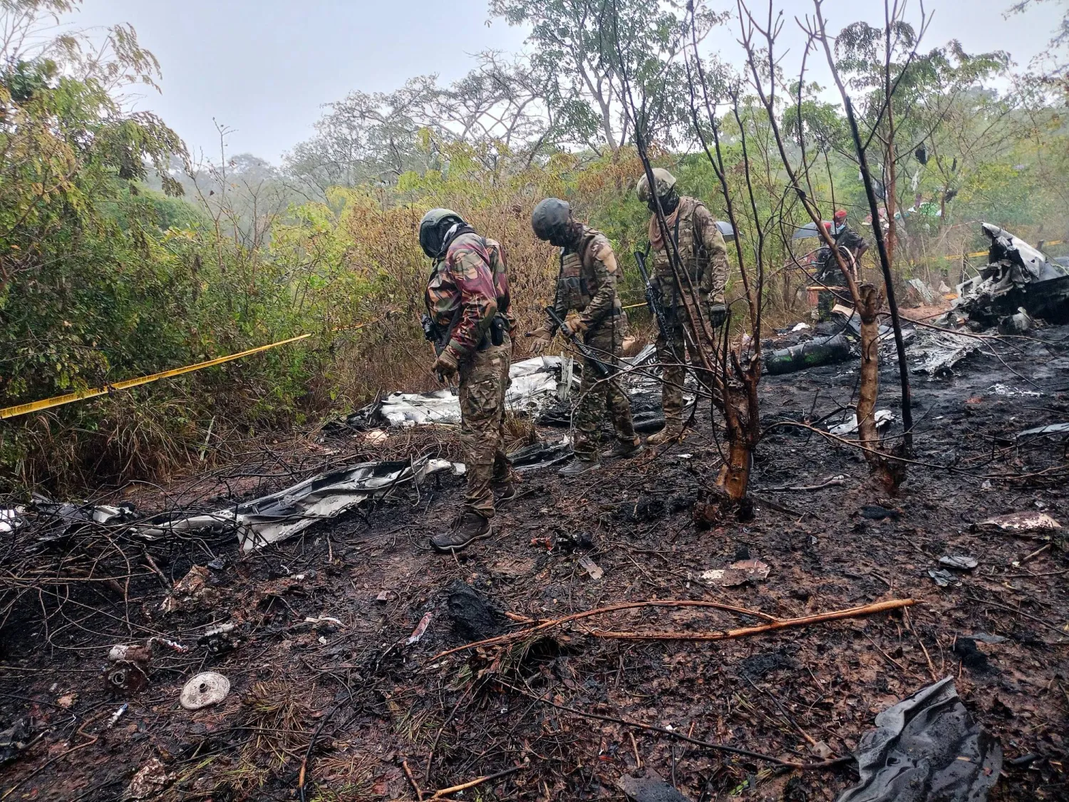 Kenyan officials inspect the scene of a plane crash near Diani, Kenya, Tuesday, Oct. 28, 2025. (AP Photo)