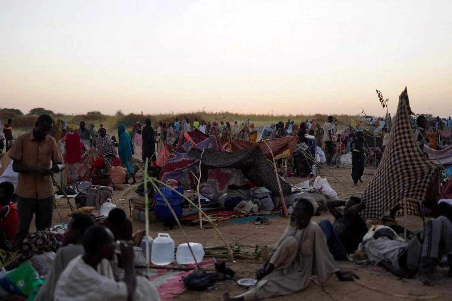  A general view of people sitting at a camp for displaced families who fled from el-Fashir to Tawila, North Darfur, Sudan, October 27, 2025. (Reuters)