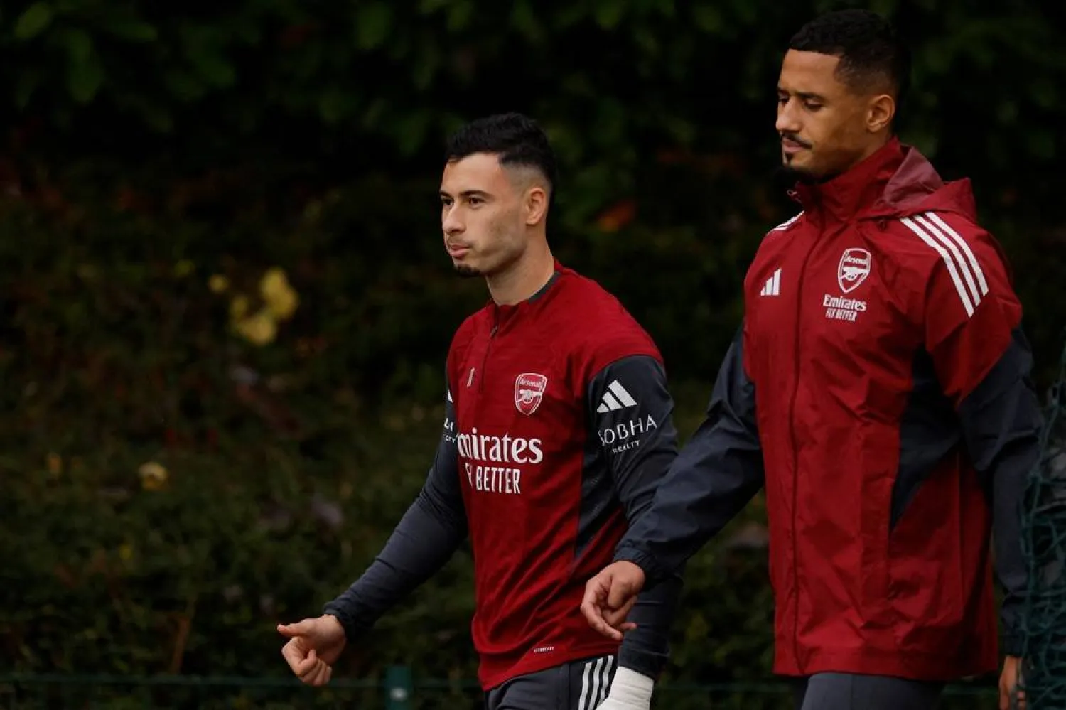 Football - UEFA Champions League - Arsenal Training - Arsenal Training Center, London Colney, Britain - October 20, 2025 Arsenal's Gabriel Martinelli and William Saliba during training. (Action Images via Reuters)