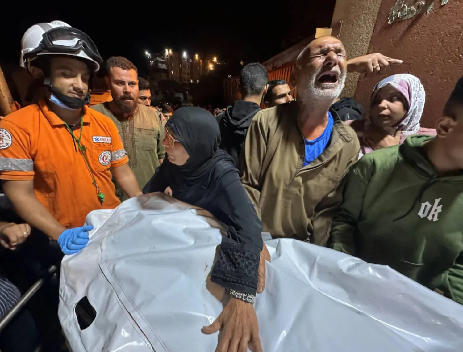 Palestinians mourn a man killed in the bombing of ''Nasser Hospital'' in Khan Younis, October 28, 2025 - Reuters