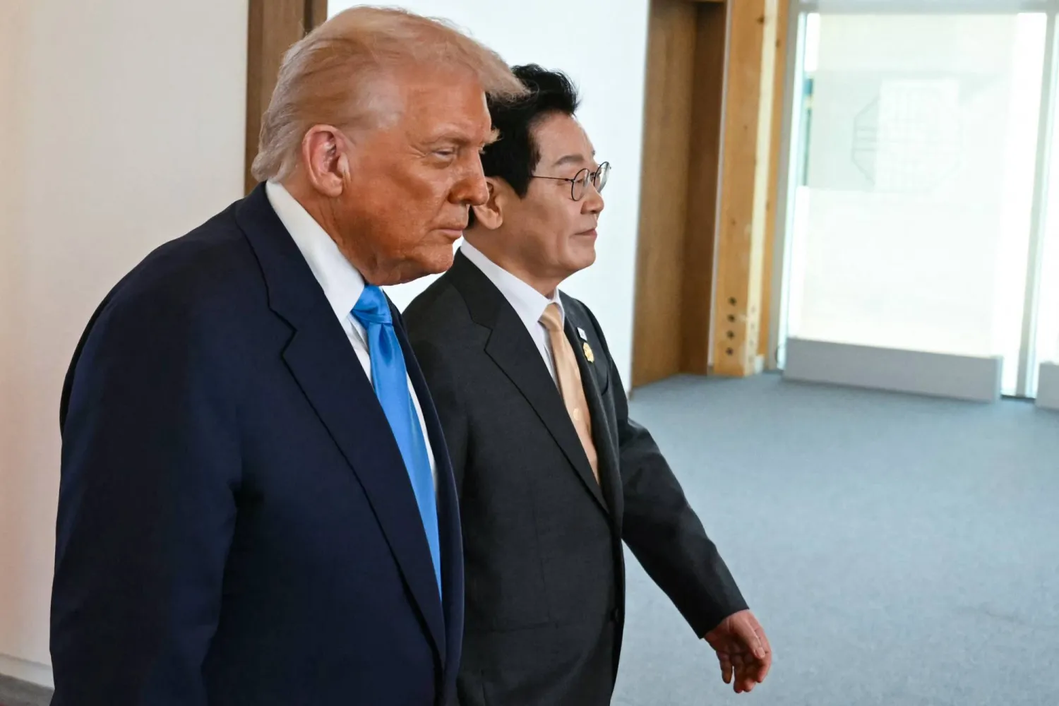 US President Donald Trump and South Korean President Lee Jae Myung walk at the Gyeongju National Museum in Gyeongju on October 29, 2025. (Photo by ANDREW CABALLERO-REYNOLDS / AFP)