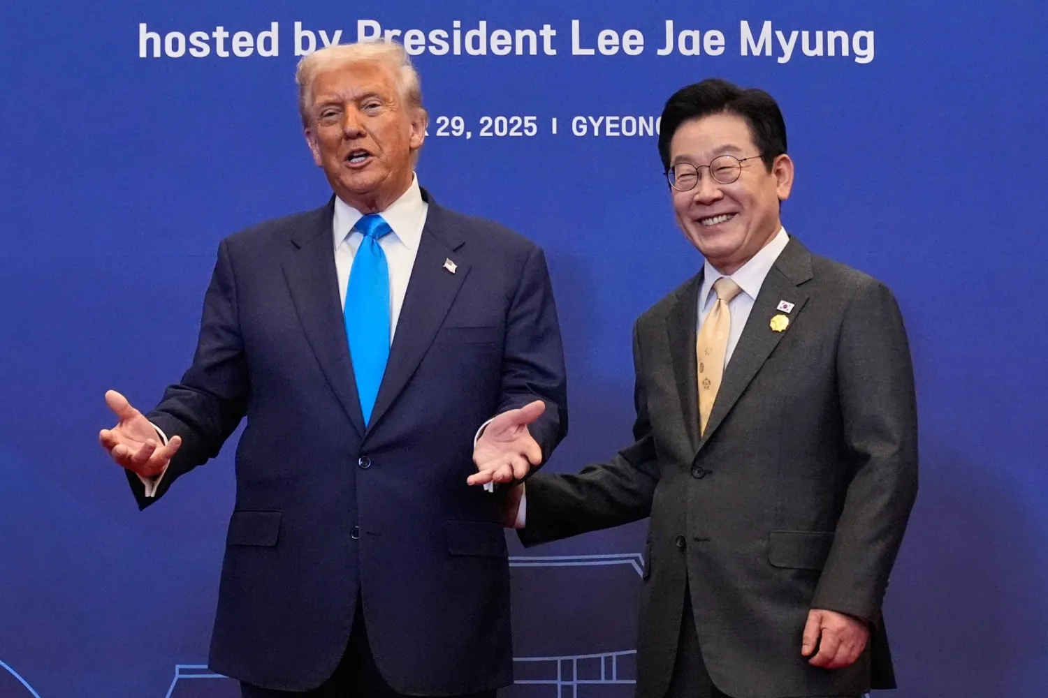 President Donald Trump poses for a photo with South Korean President Lee Jae Myung during a dinner event in Gyeongju, South Korea, Wednesday, Oct. 29, 2025. (AP Photo/Mark Schiefelbein)