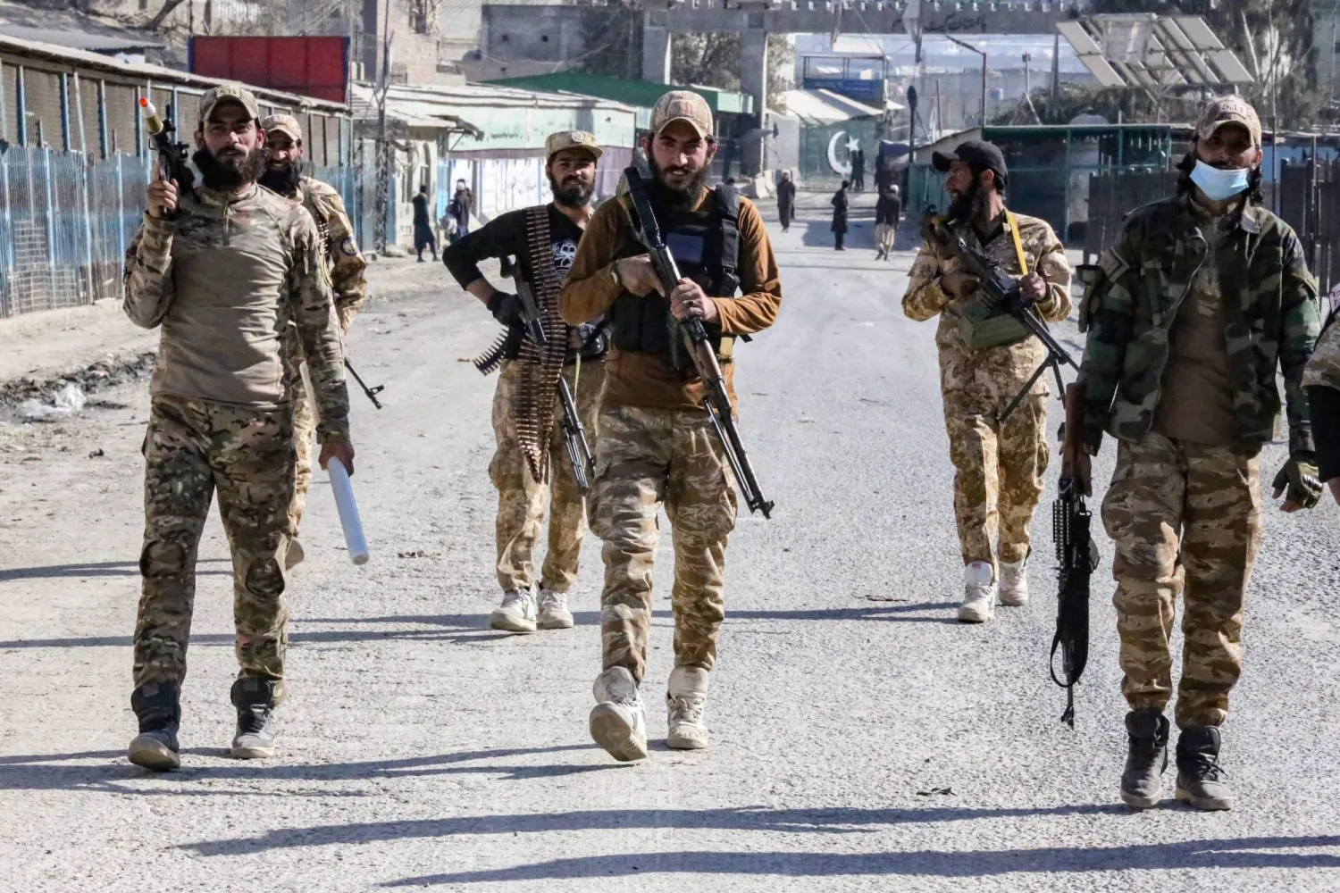 Afghan security personnel patrol near the zero point Torkham border crossing between Afghanistan and Pakistan, in Nangarhar province on January 15, 2024. (Photo by Shafiullah KAKAR / AFP)