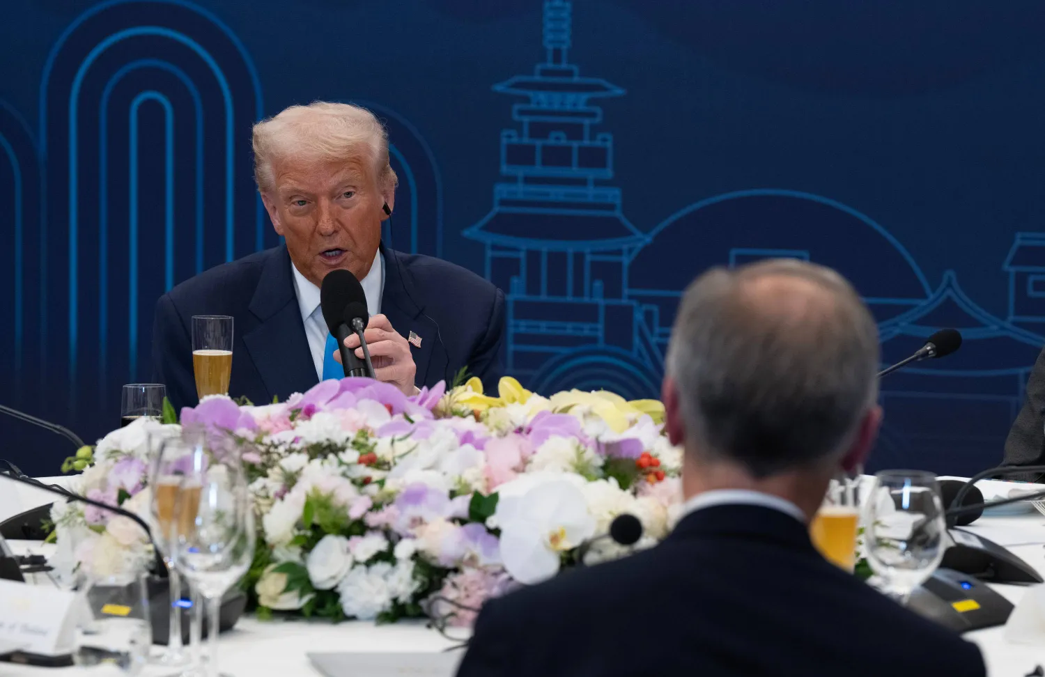President Donald Trump looks towards Canada Prime Minister Mark Carney as he delivers remarks at a dinner hosted by South Korea President Lee Jae-Myung in Gyeongju, South Korea, Wednesday, Oct 29, 2025. (Adrian Wyld/The Canadian Press via AP)