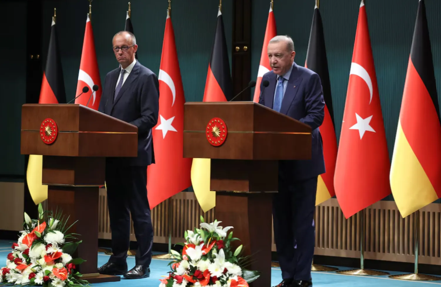 Turkish President Tayyip Erdogan and German Chancellor Friedrich Merz attend a press conference at the Presidential Palace in Ankara, Türkiye, October 30, 2025. REUTERS