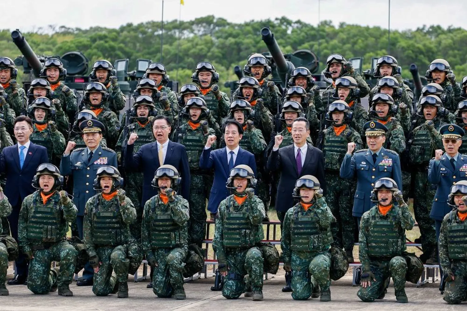 Taiwan's President Lai Ching-te (C) poses for a photograph next to Taiwanese soldiers and officials during the launching ceremony for the M1A2T Tank Battalion, in Hukou Township, Hsinchu County, Taiwan, 31 October 2025. (EPA)