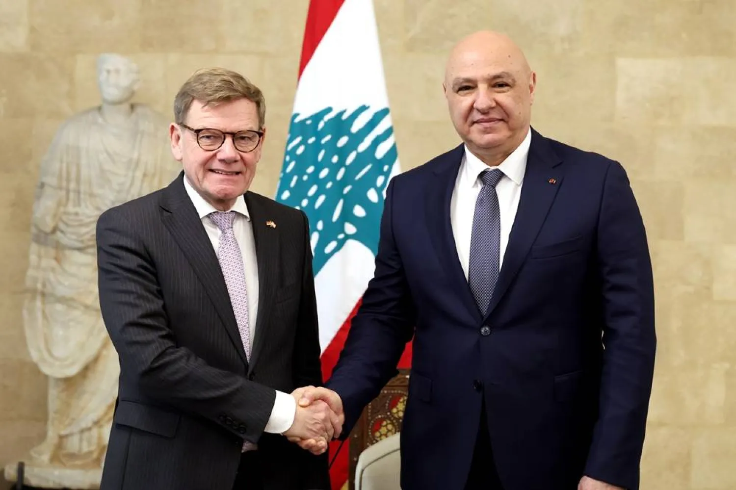 A handout photo made available by the Lebanese Presidency Press Office shows Lebanese President Joseph Aoun (R) shaking hands with German Foreign Minister Johann Wadephul (L) at the presidential palace in Baabda, east of Beirut, Lebanon, 31 October 2025. (Lebanese Presidency)