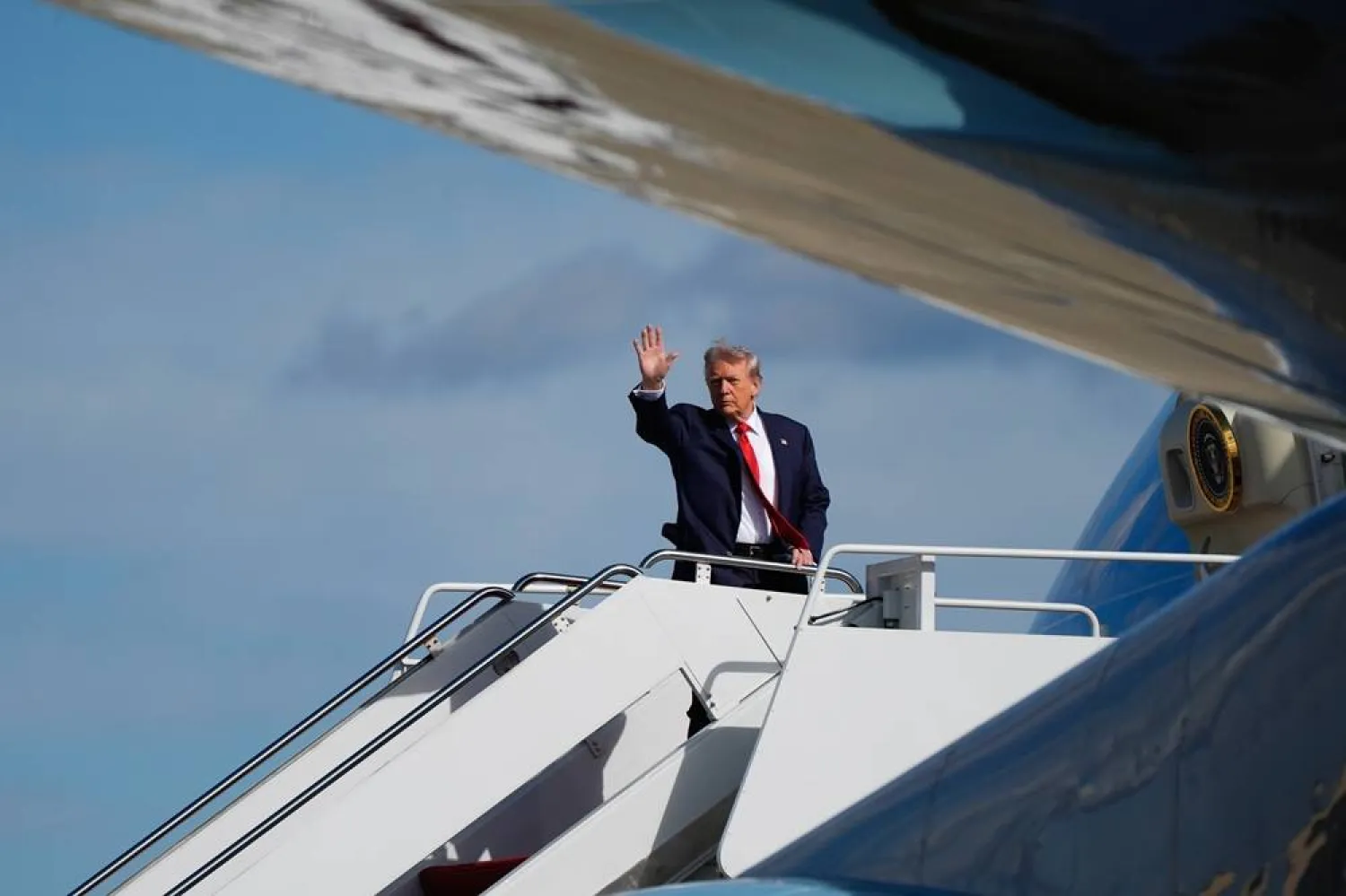  President Donald Trump waves as he boards Air Force One at Joint Base Andrews, Md., Friday, Oct. 31, 2025, en route to Florida. (AP) 
